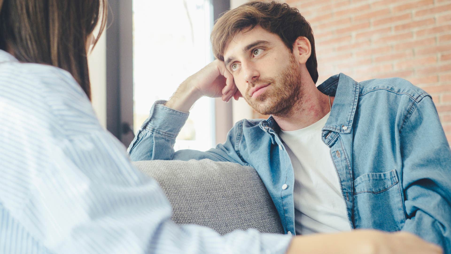 Man saying "I'm doing my best" to his wife.