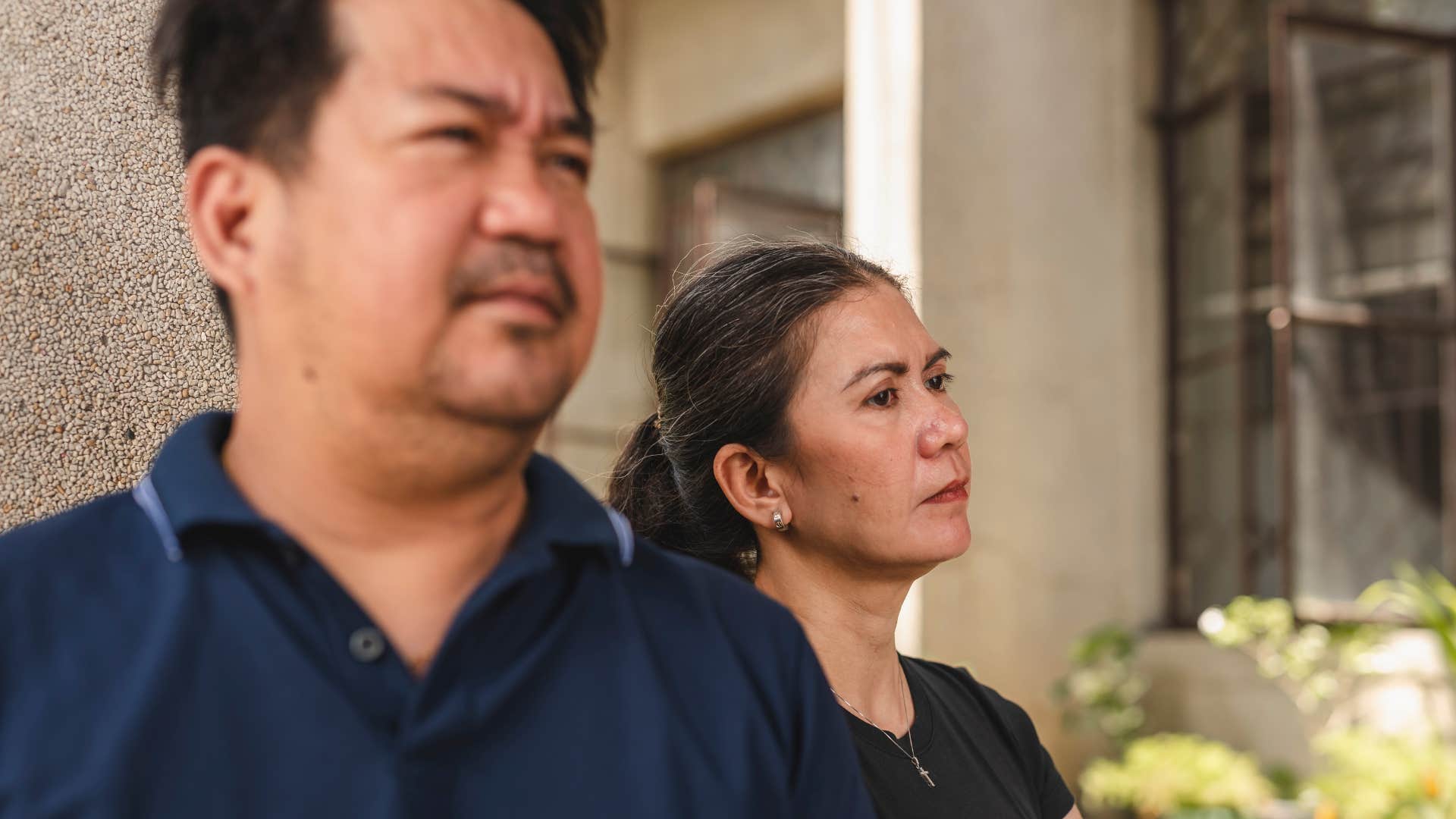 Man saying "I'm fine" next to his wife.