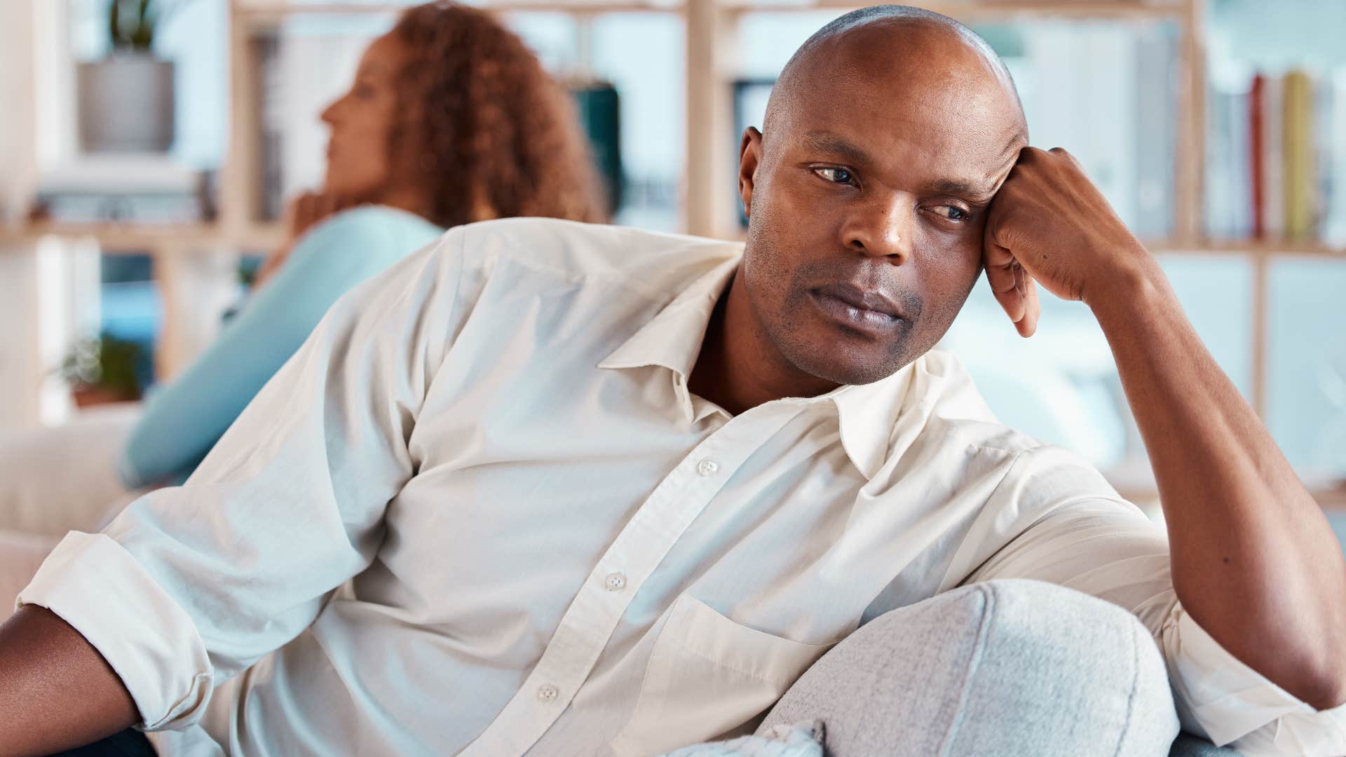 Man saying "whatever you want" to his wife.