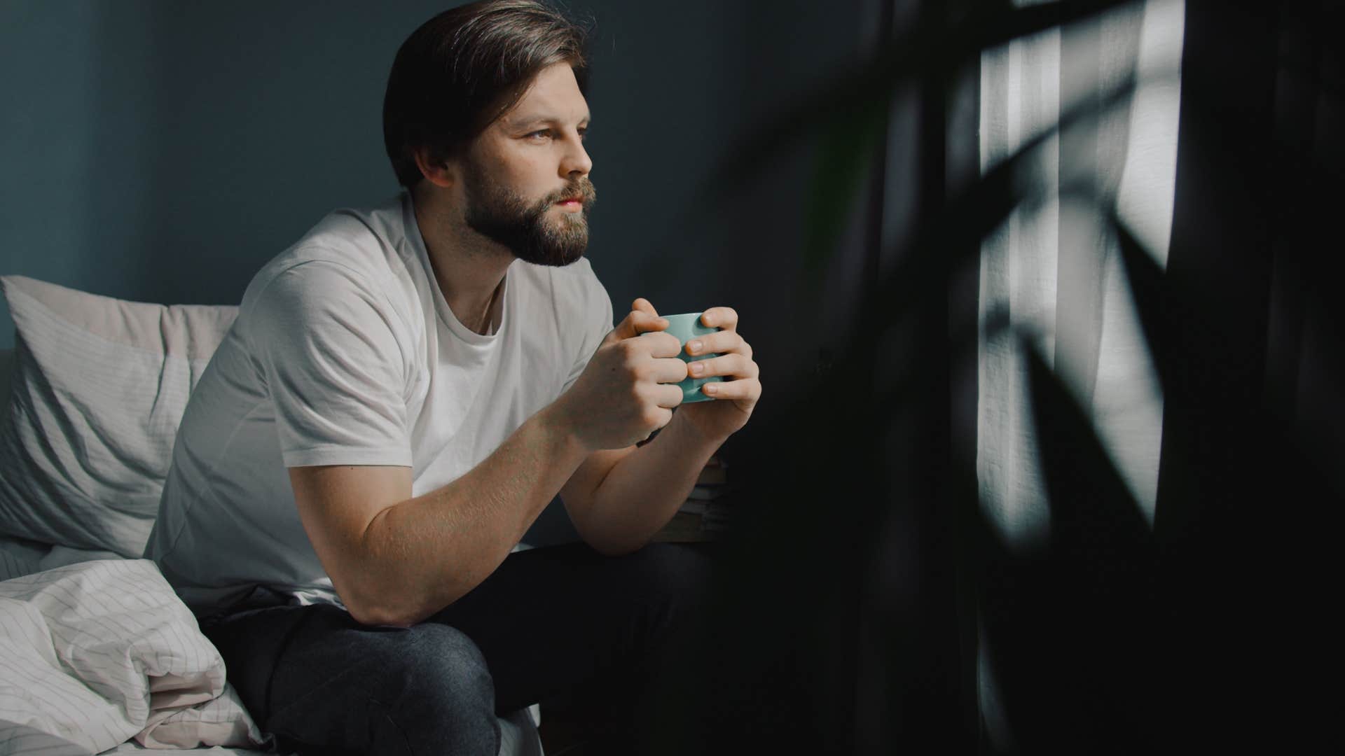 man who needs extra time to decompress drinking tea