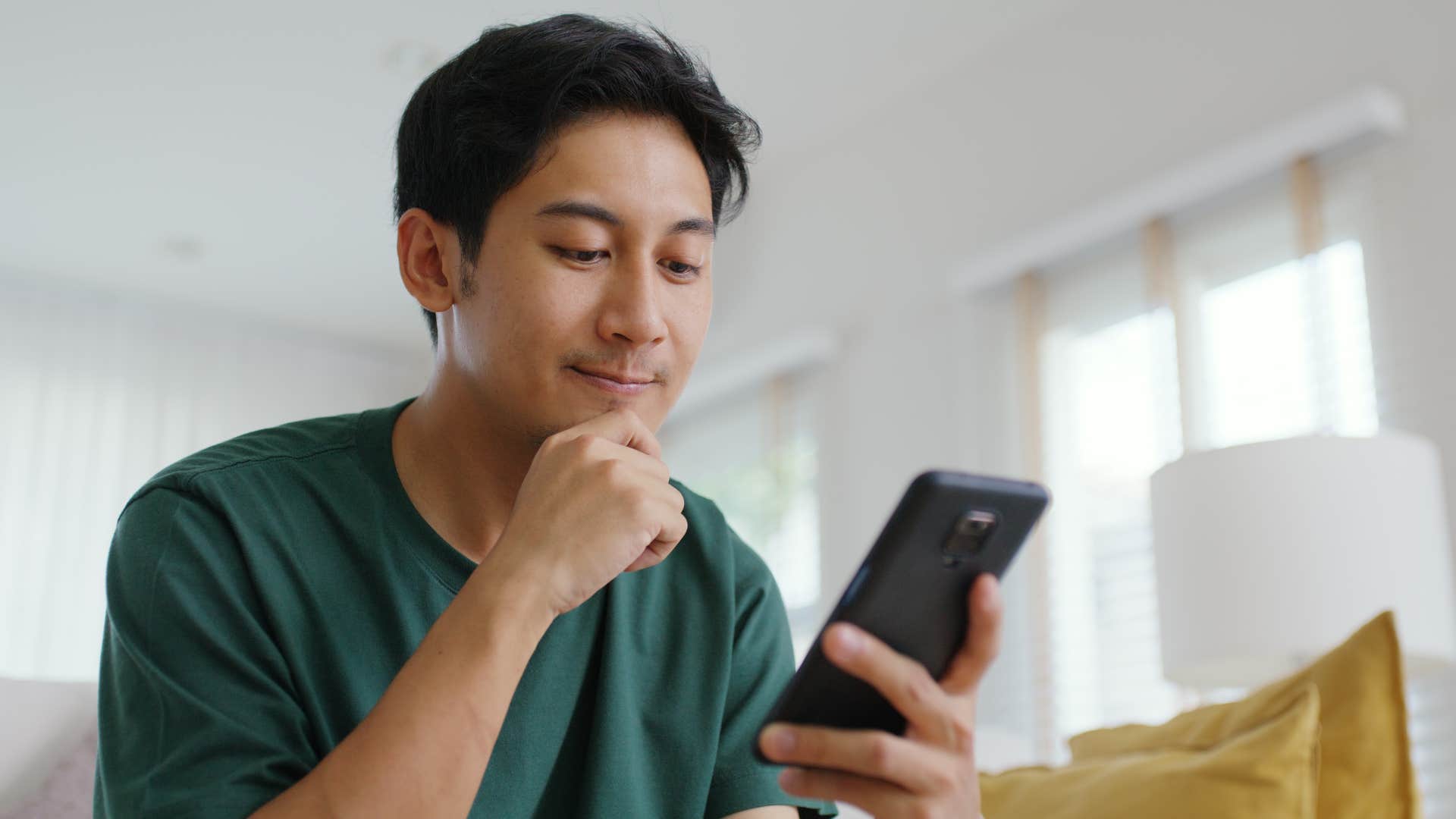 man looking at his phone