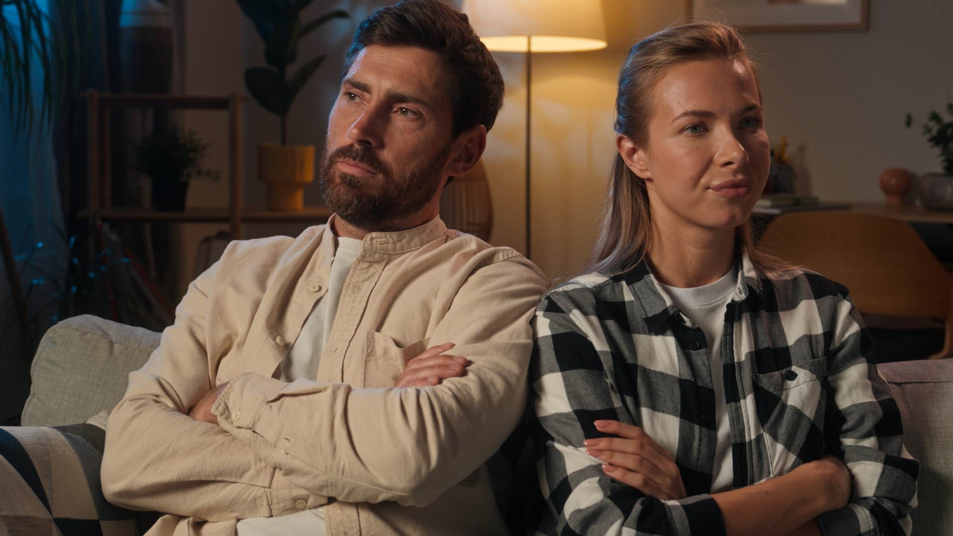 man sitting with his wife who avoids talking about the future