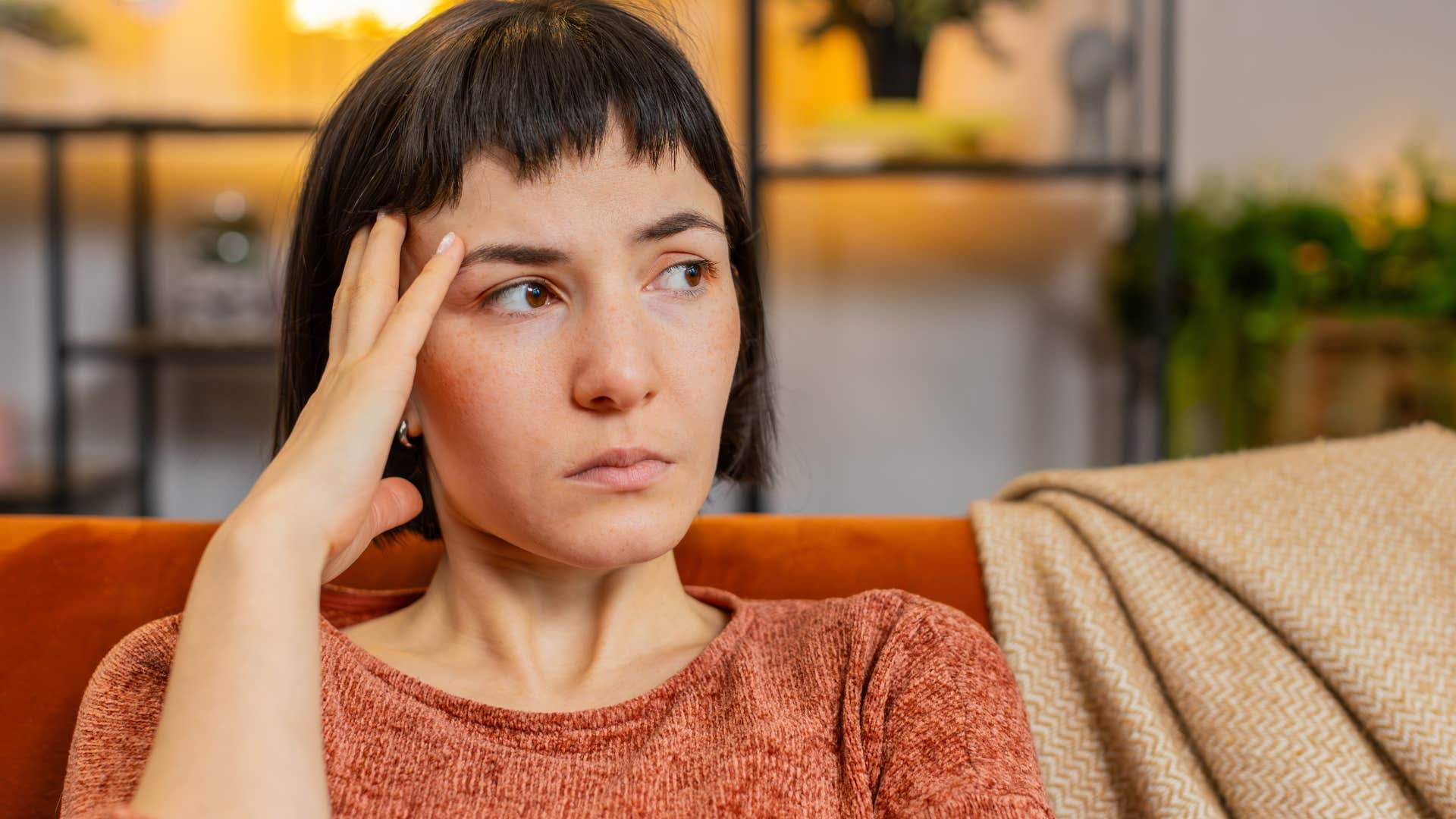 Woman who's stopped making an effort with her appearance at home.