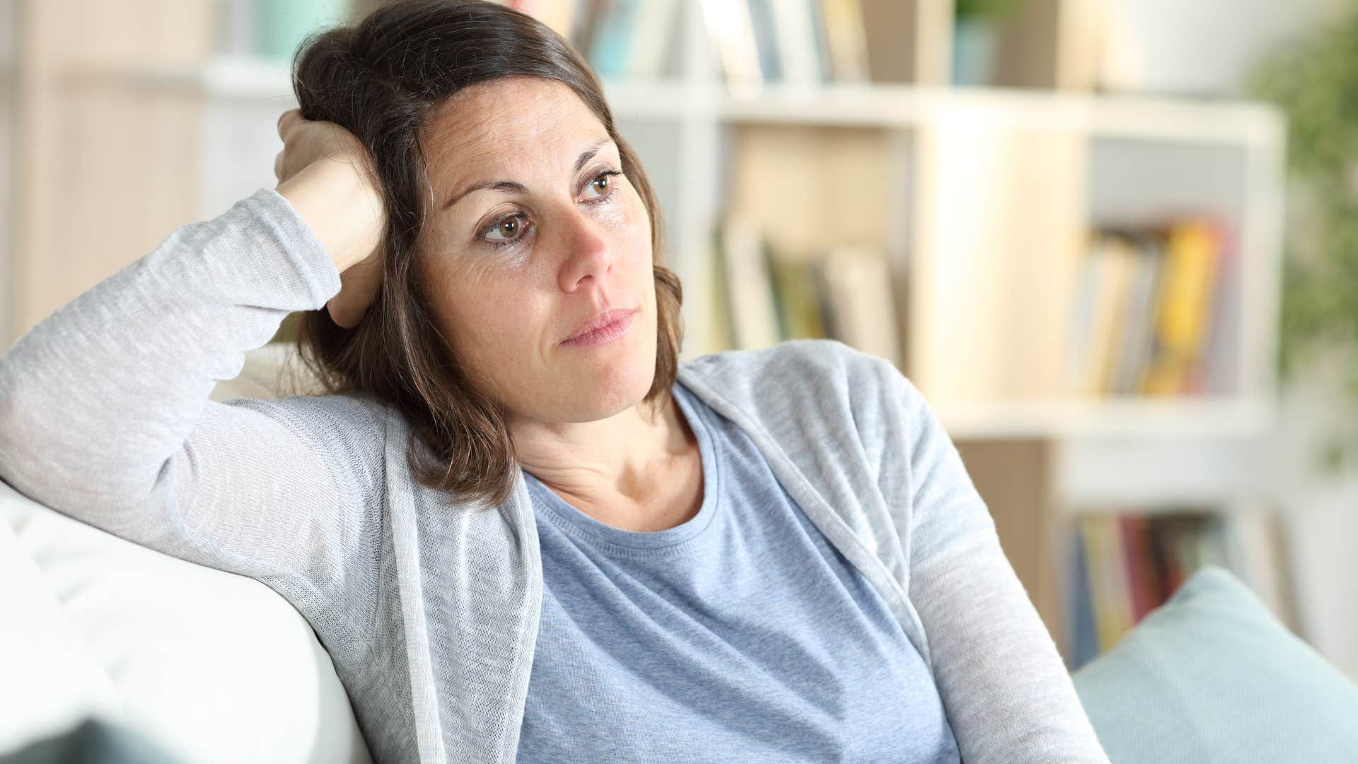 Woman who never asks how he's doing sitting at home.
