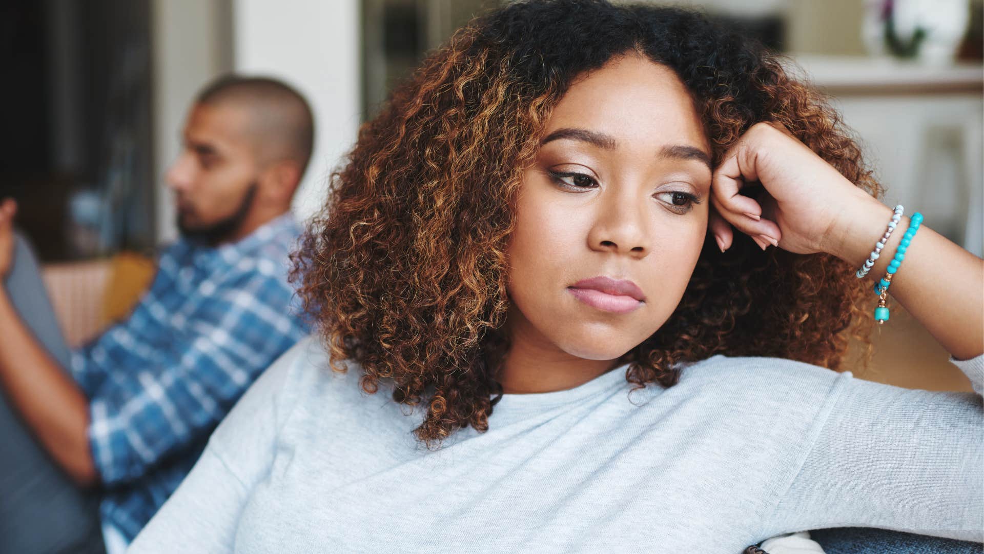 Woman who refuses to argue turned away from her husband.