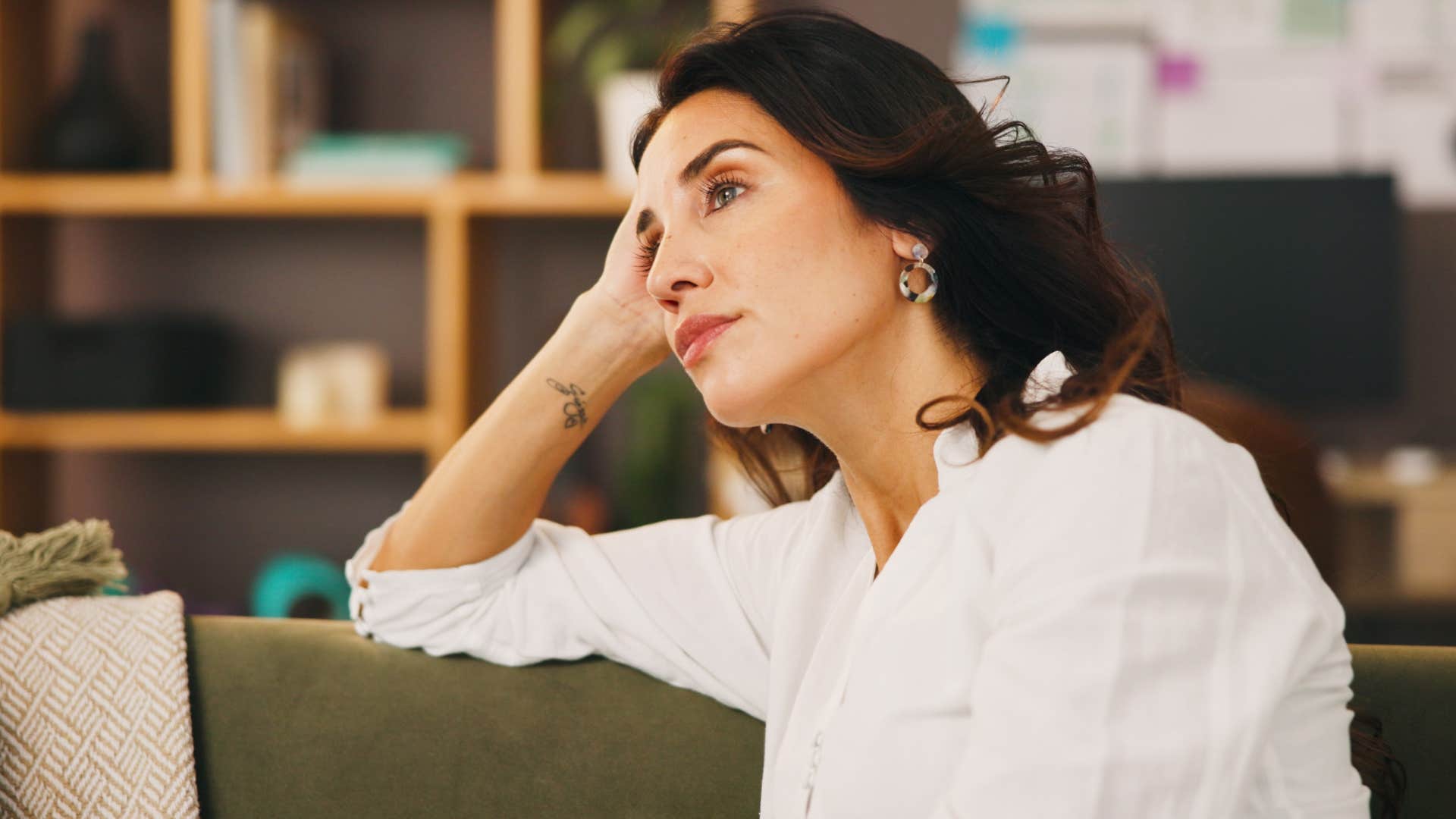 Woman who lets resentment fester sitting at home.