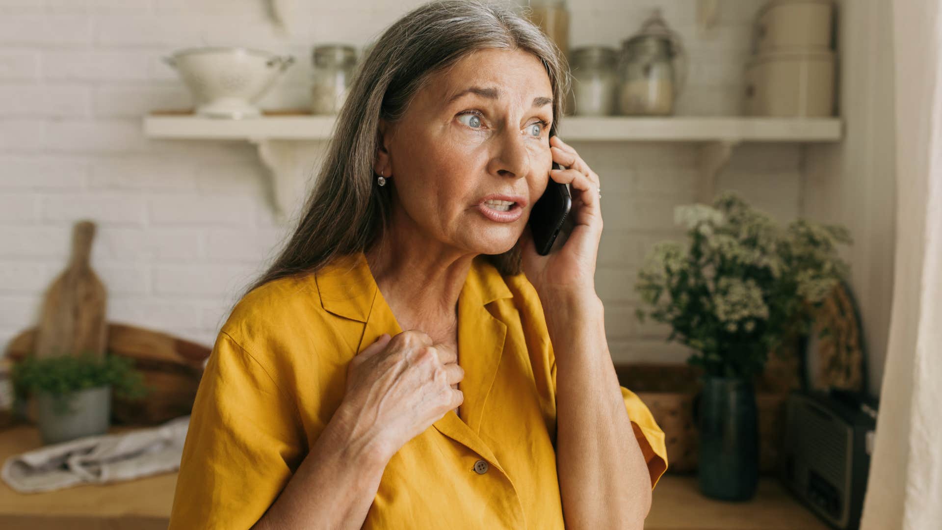 Woman who's stopped defending her husband talking on the phone.