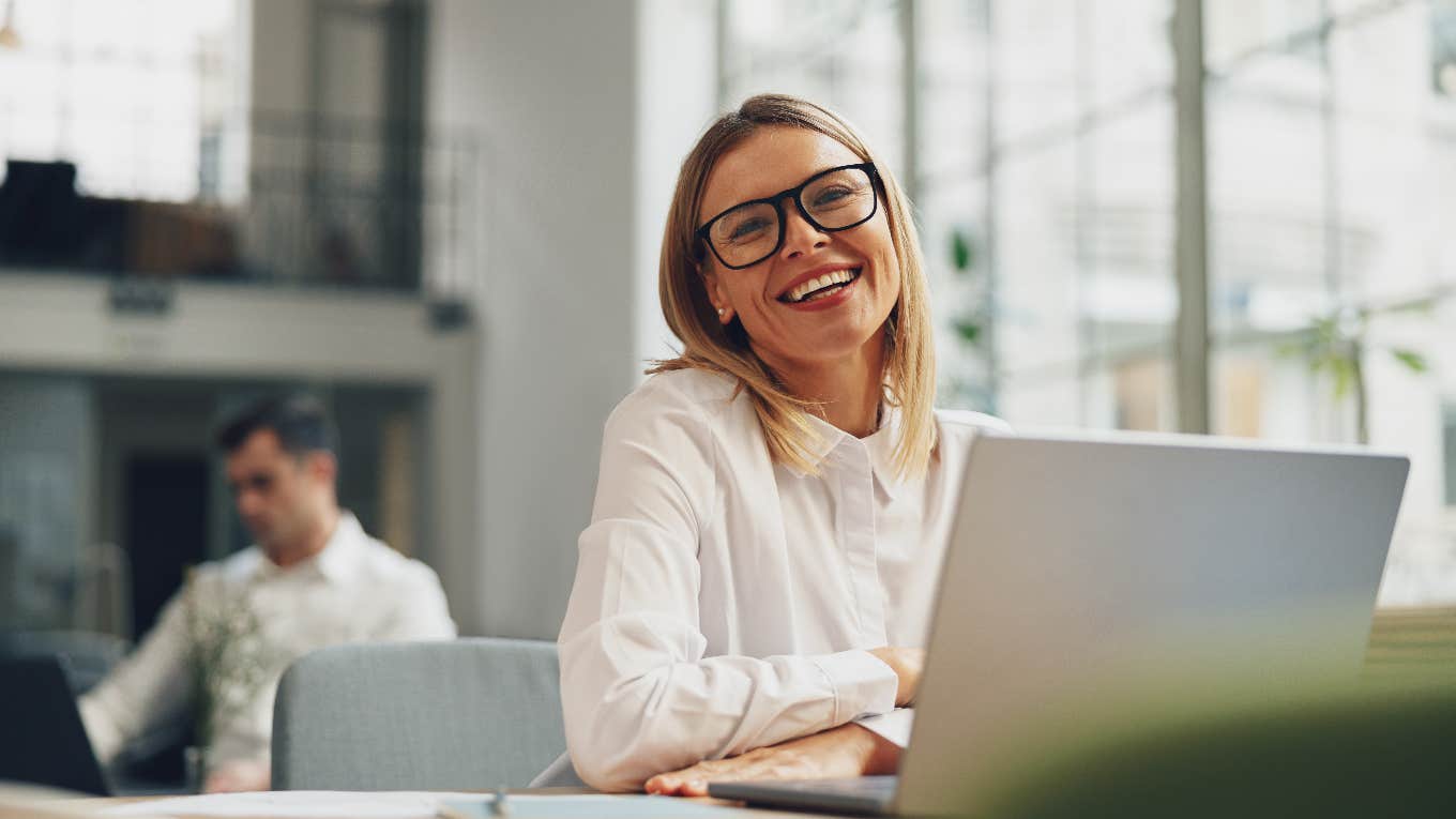 happy co-worker who thinks her job is her entire life