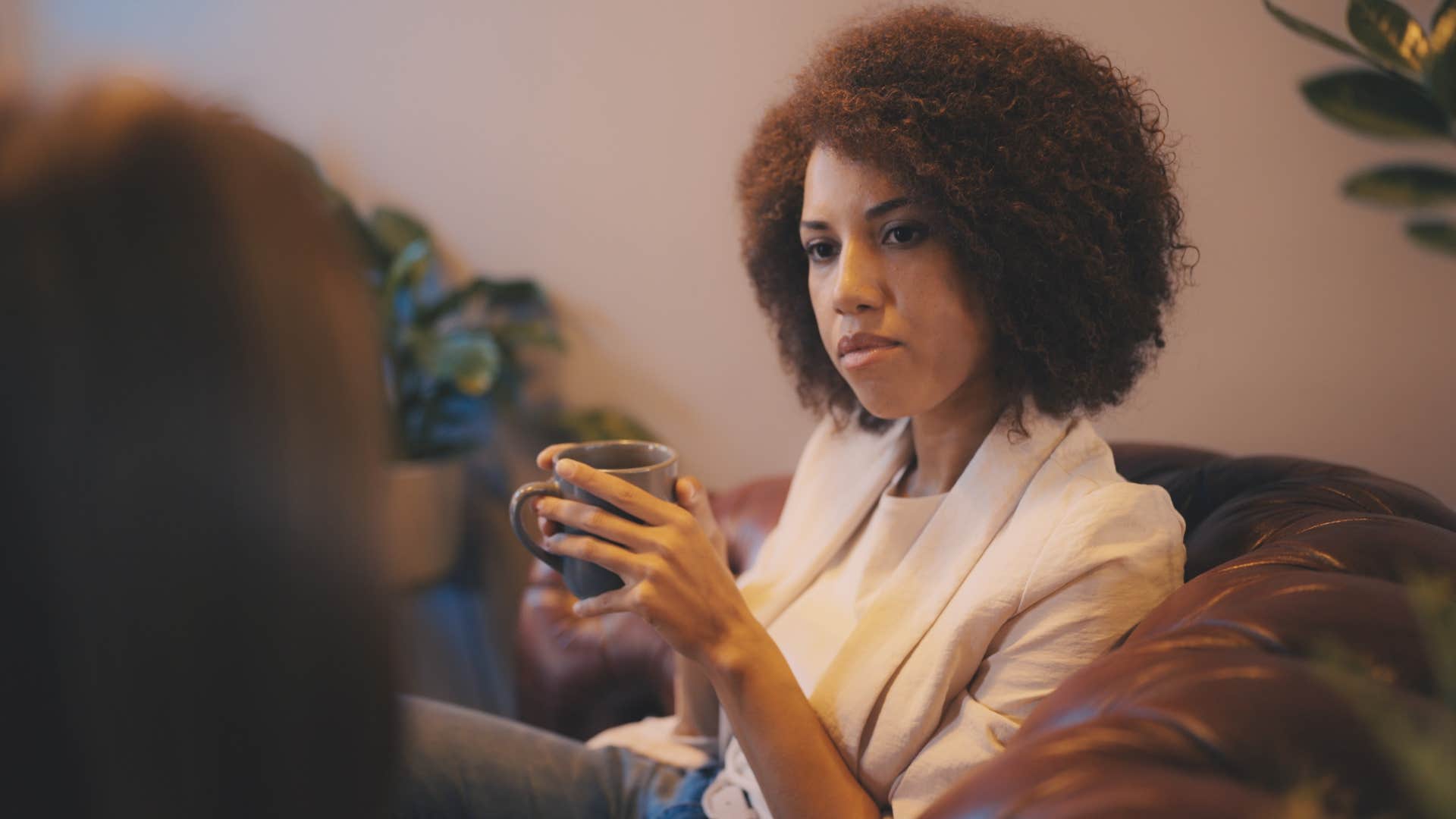 woman listening to friend speak keeping her secrets