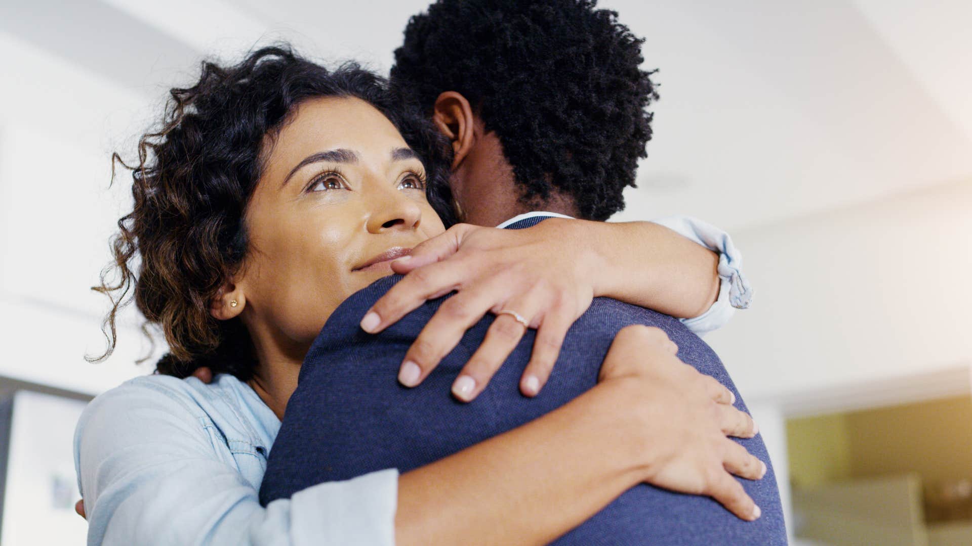 Man in love shows physical affection by hugging
