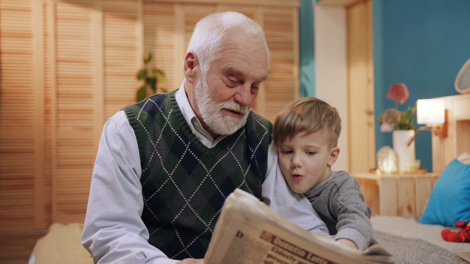 grandpa reading newspaper with nephew