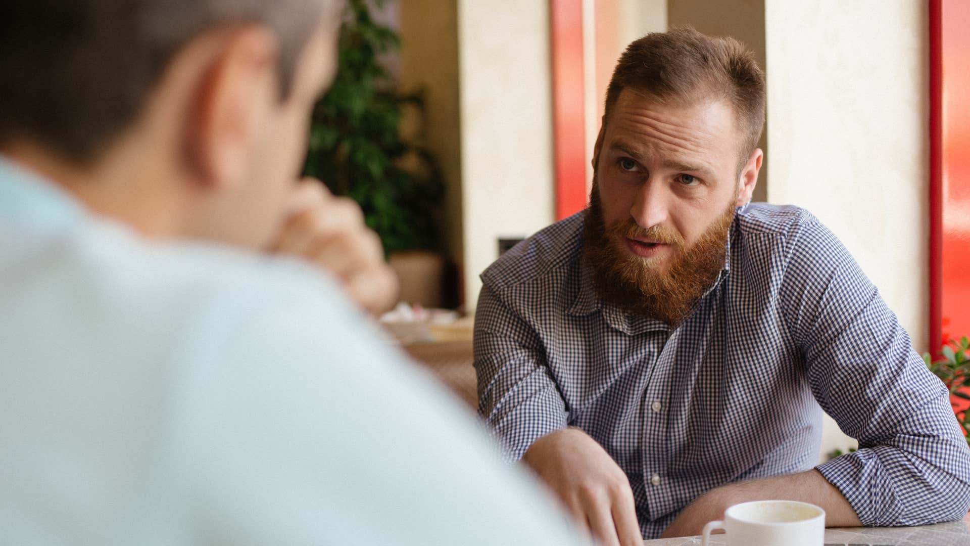 if someone can't stop doing these things they're probably more controlling than they even realize insisting on knowing everything know it all man explaining something to colleague