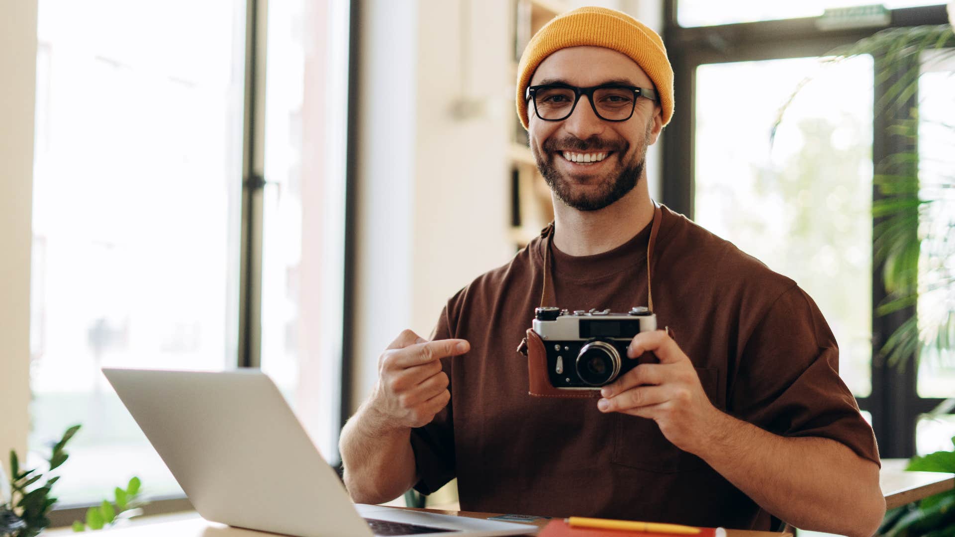 man hyper-fixating on his camera