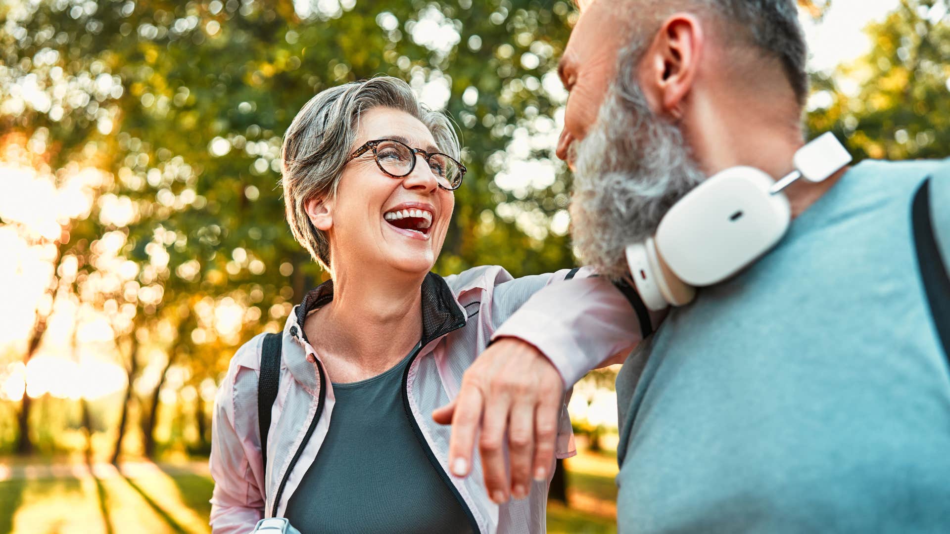 woman who cares about vibes laughing with a partner