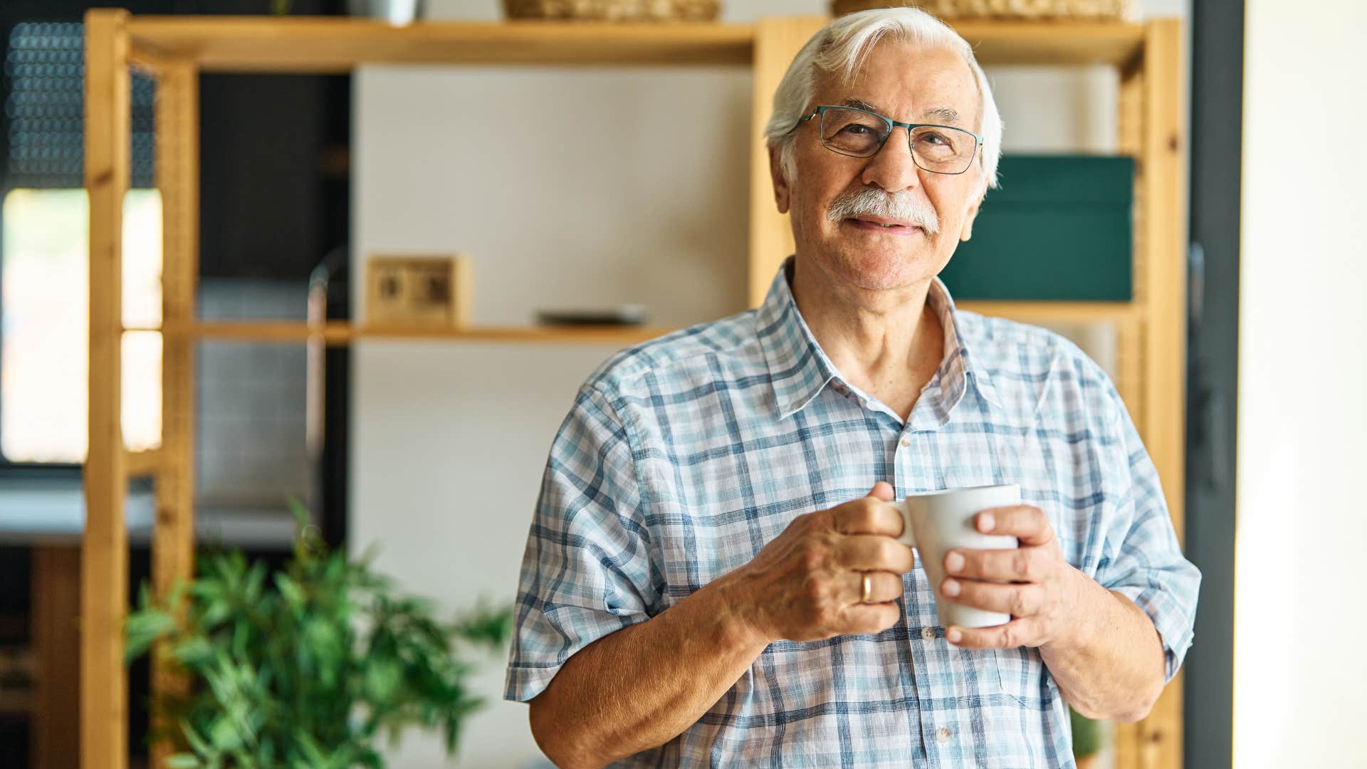 happy man spending a lot of time alone smiling