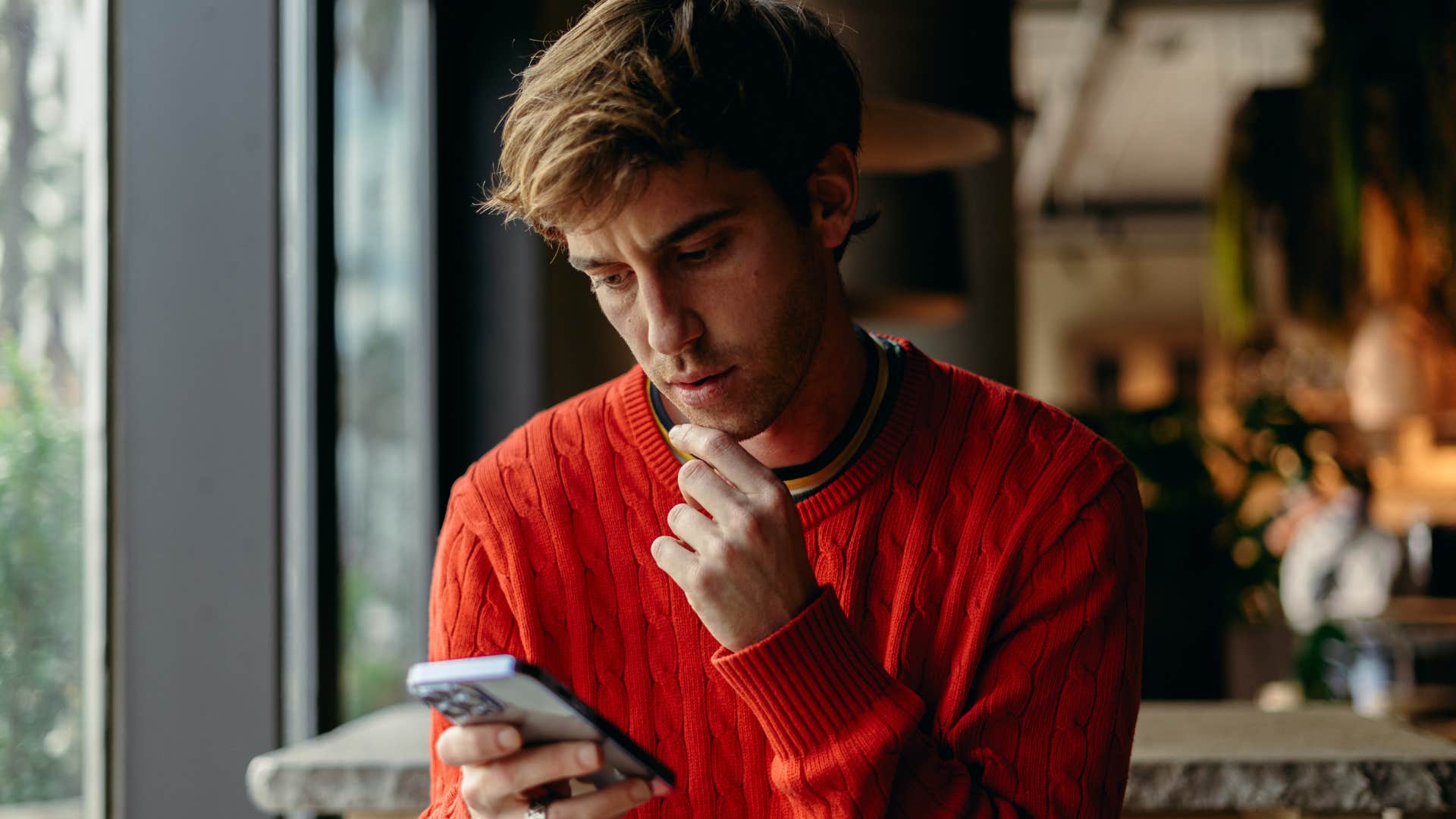 whatever works for you if someone is a chronic people pleaser they'll send these texts during casual conversation man texting whatever works for you on his phone