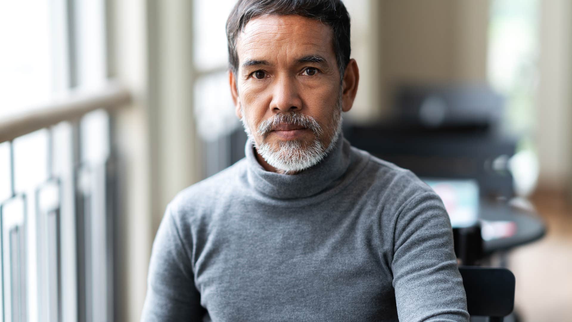 serious man sitting at home