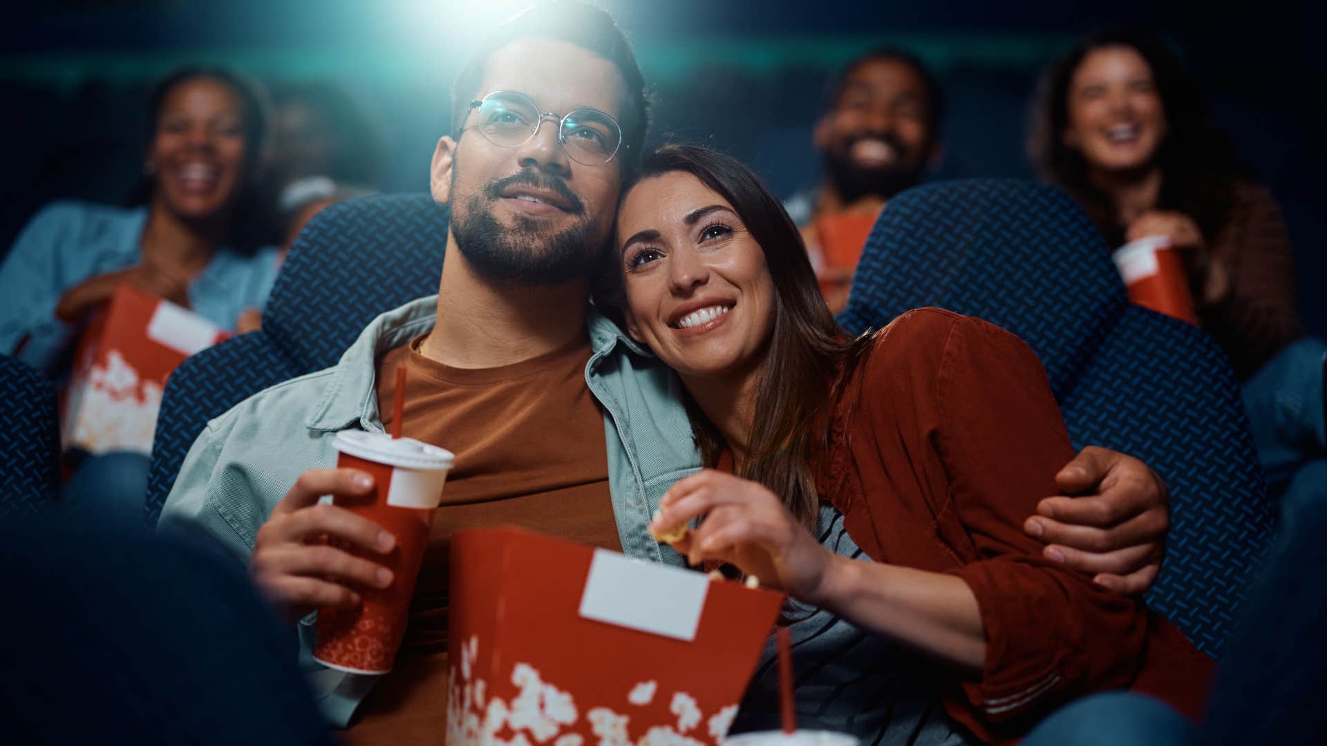 couple watching movie in theater