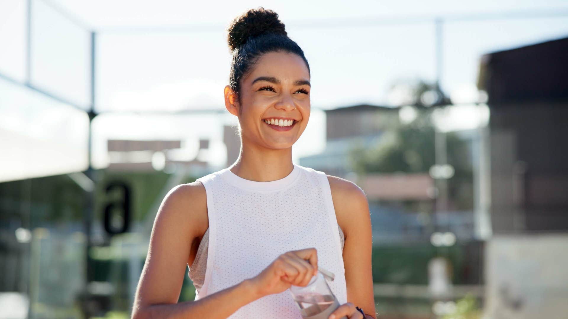 smiling woman standing outside