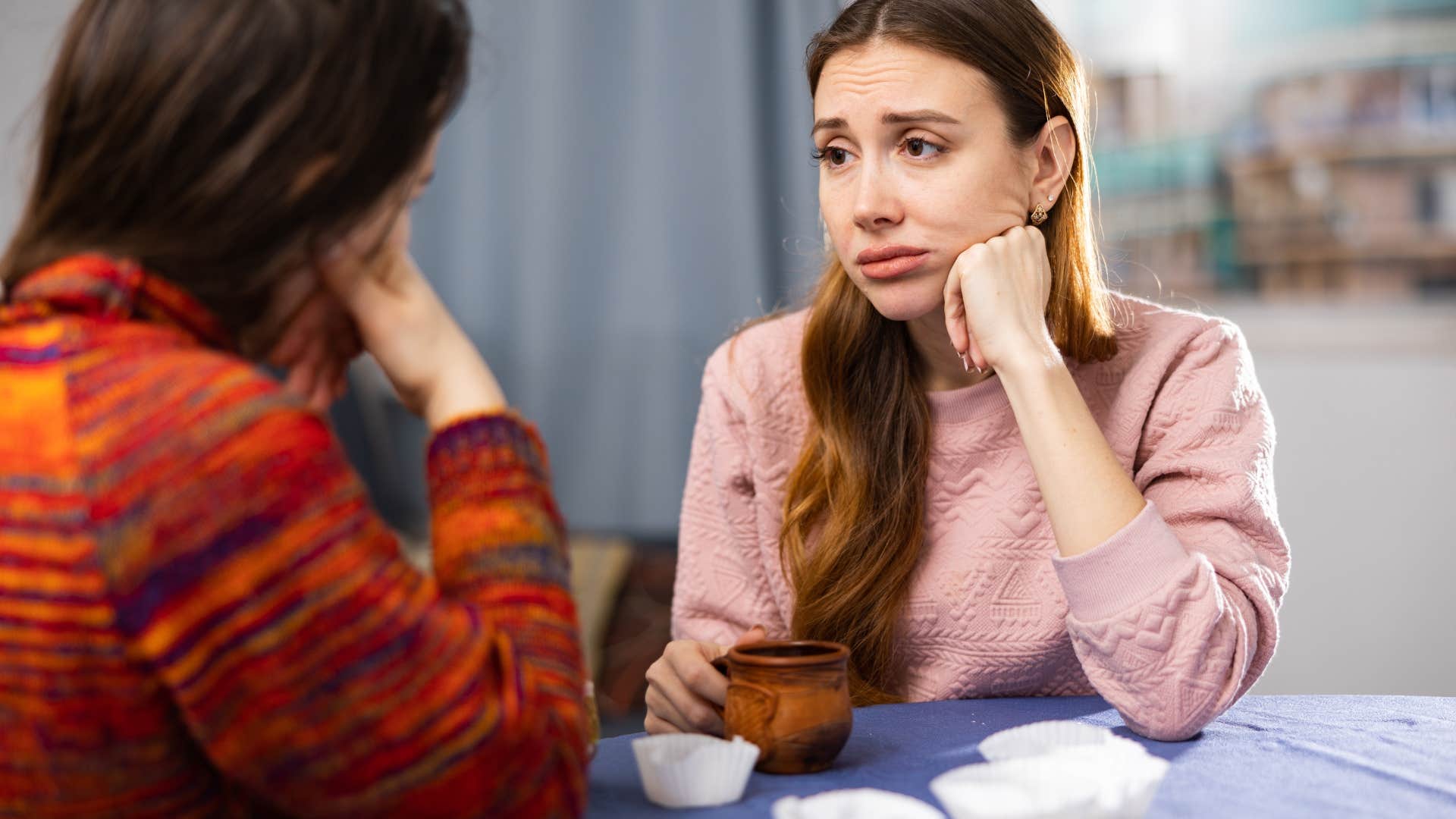 woman who is in codependent friendship apologizing for things she didn't do