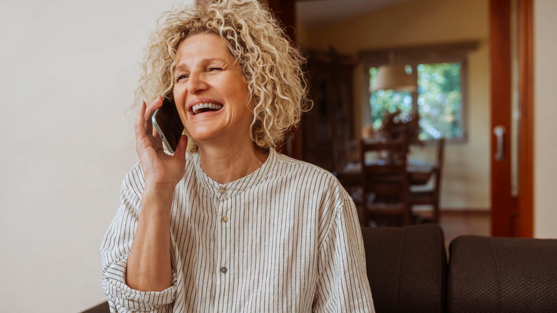 smiling woman calling her husband to say i miss you