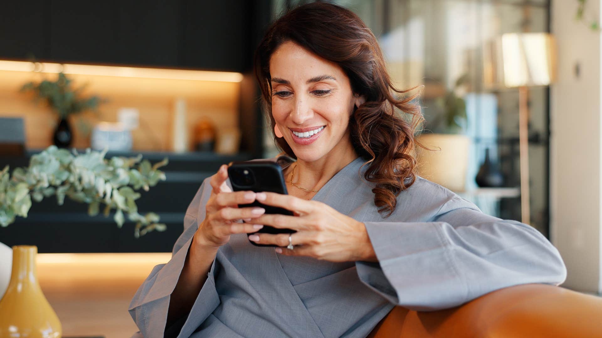 woman who's intentional about boundaries on her phone