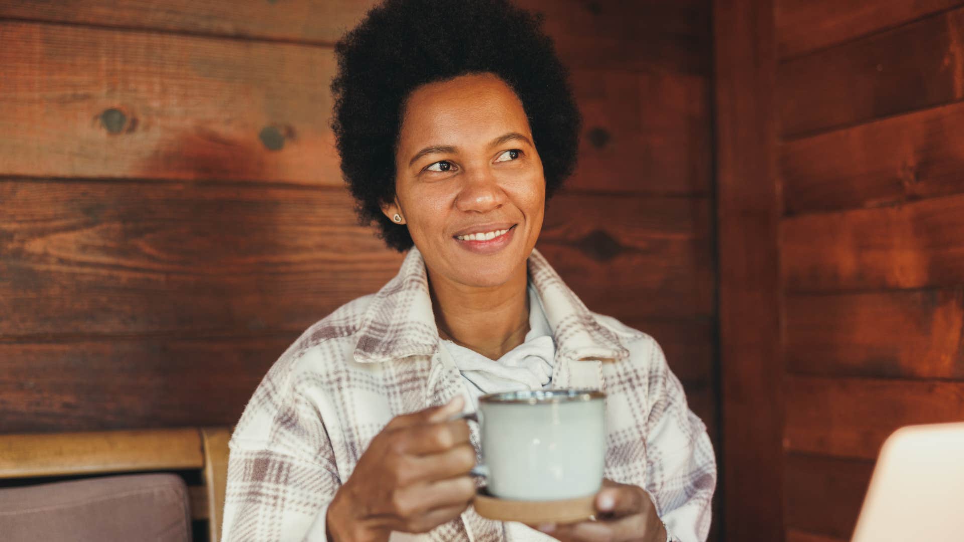 intuitive woman drinking coffee at home