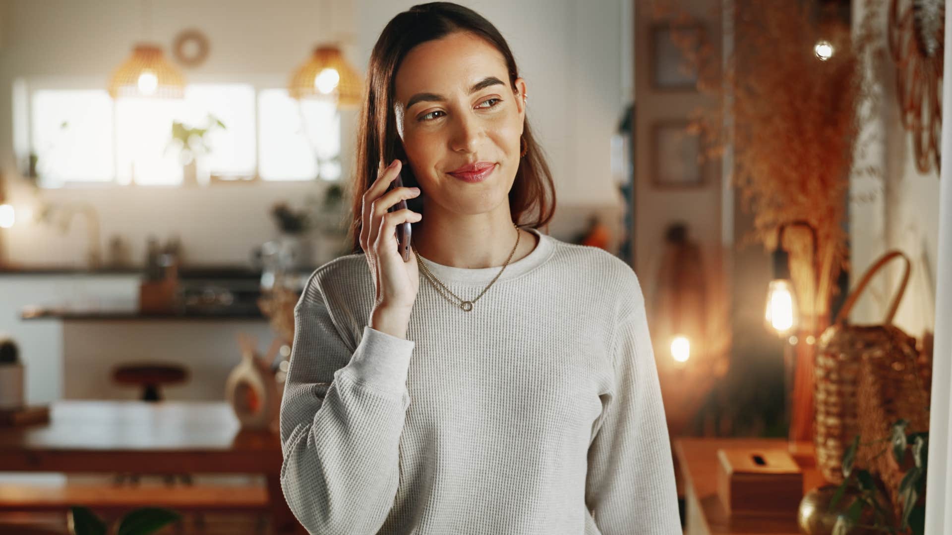 detail-oriented woman smiling on the phone