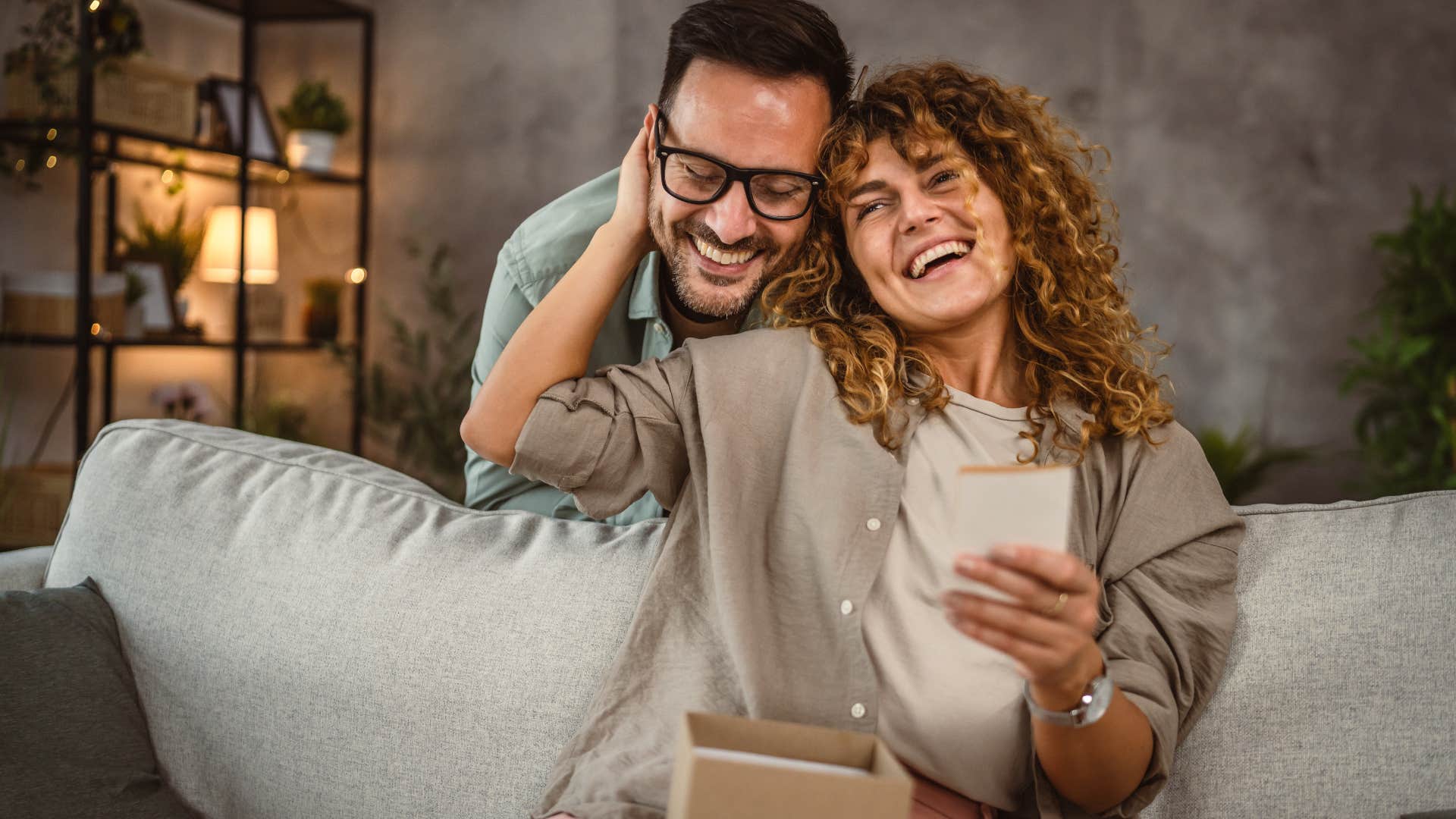 man surprising wife with a gift