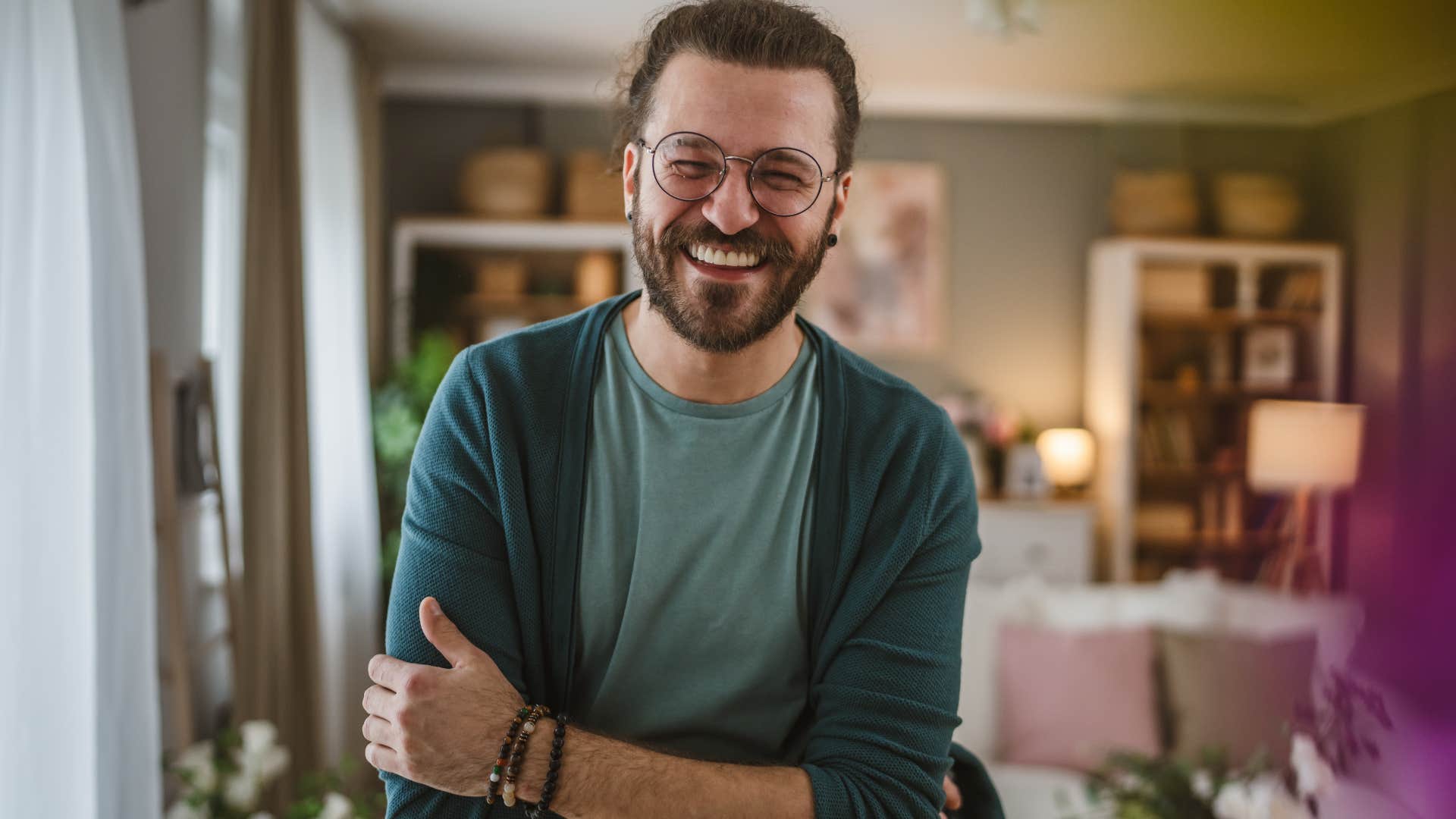 thoughtful man smiling at home
