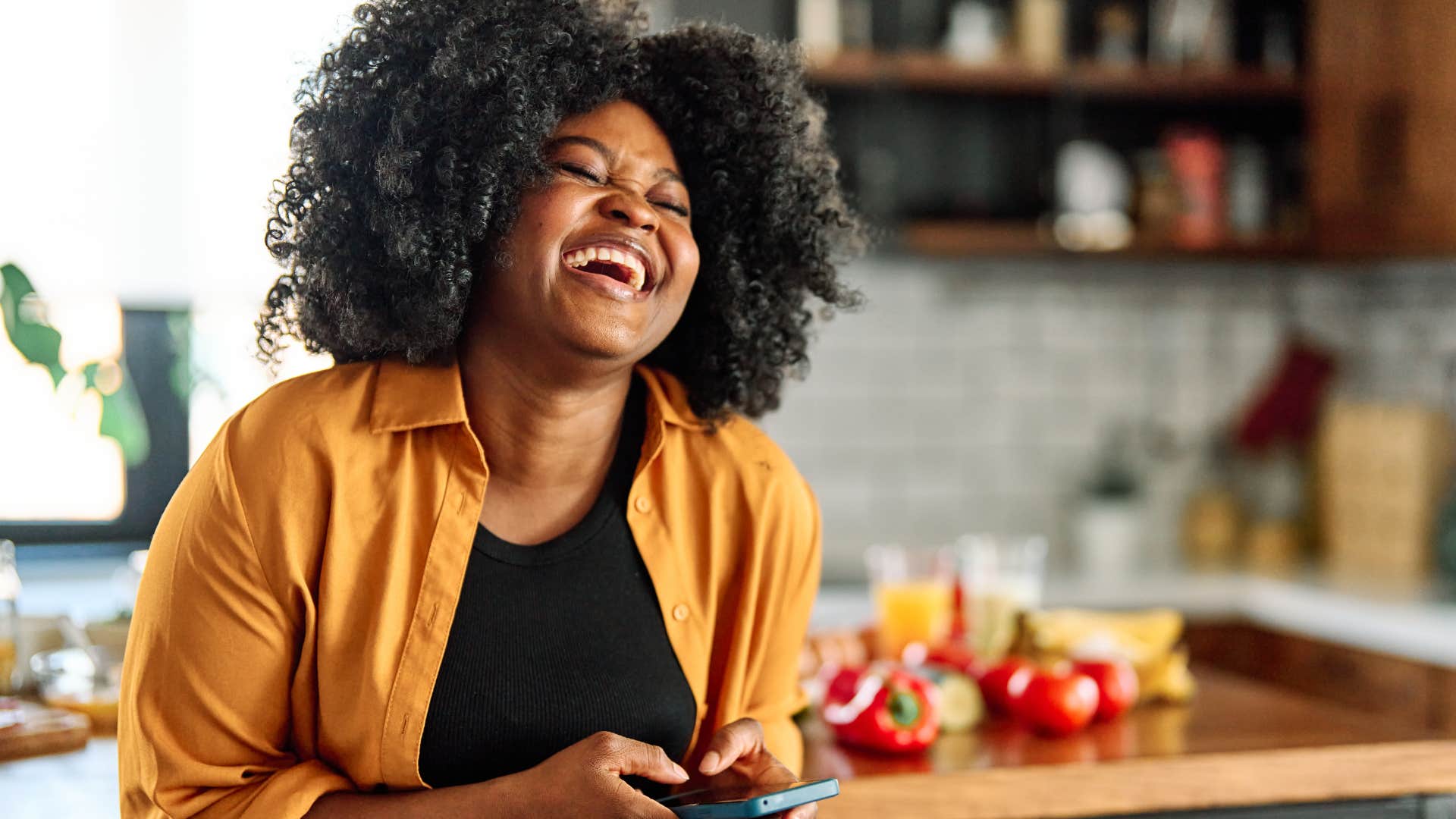 woman who's internally gratified laughing