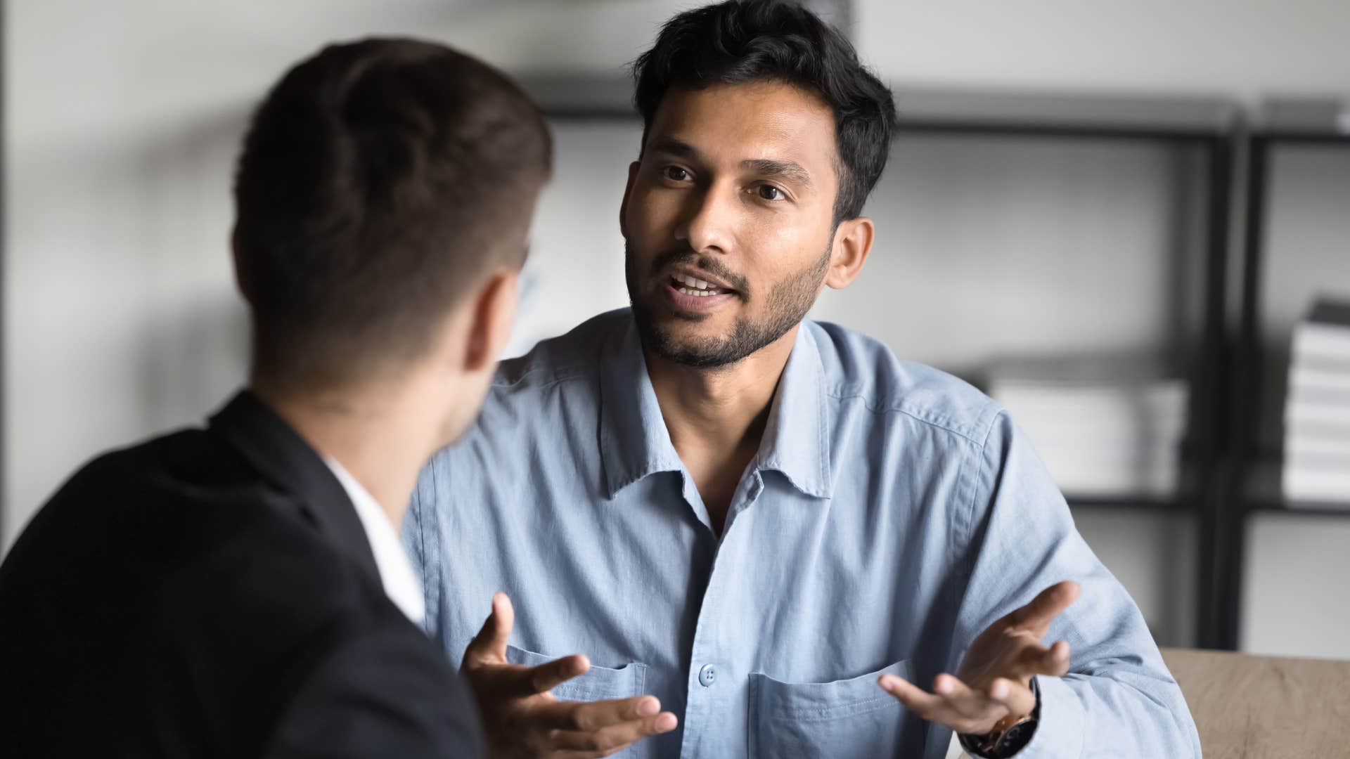 man who trusts actions more than words talking to a peer