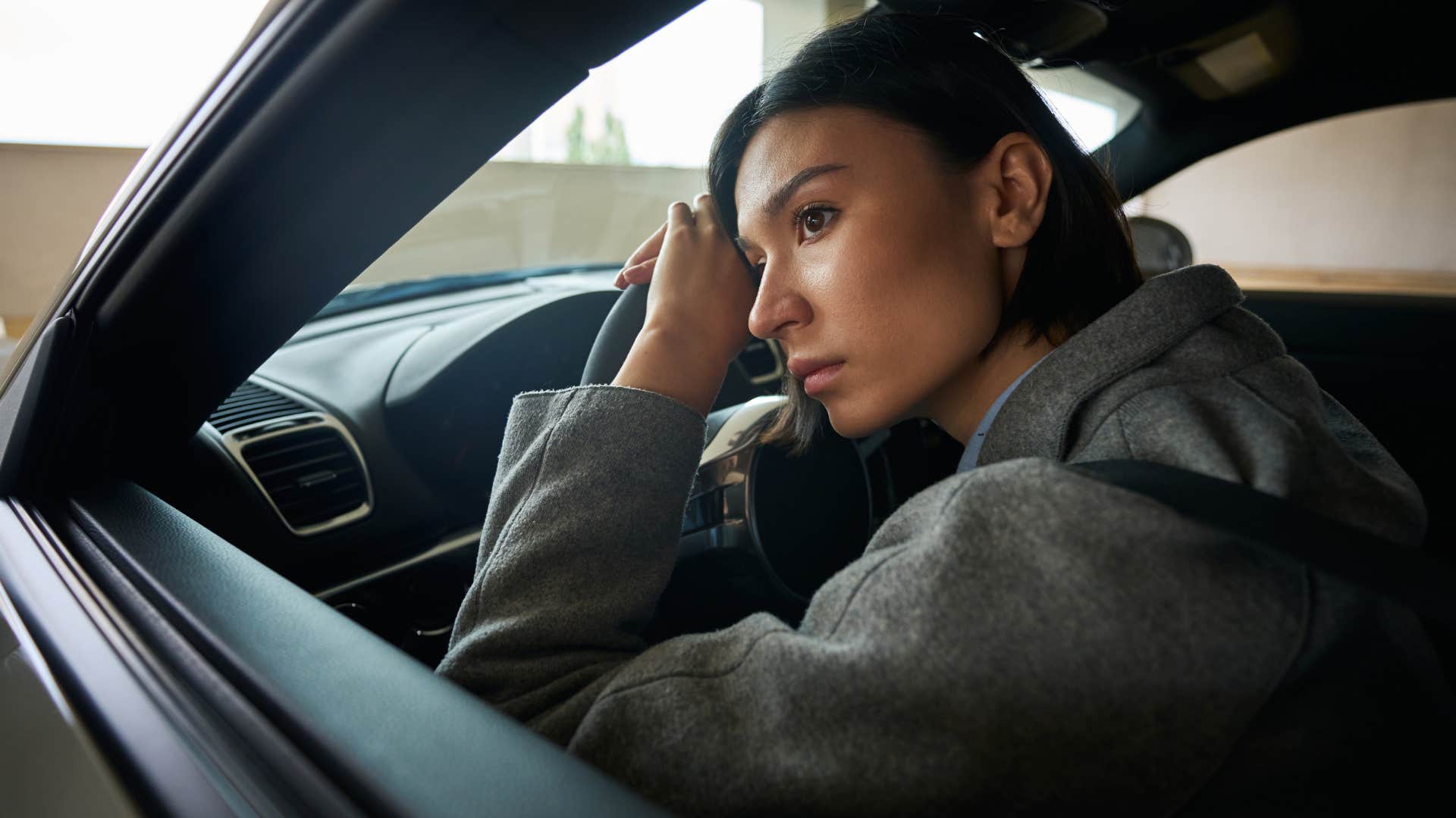 taking on unnecessary negativity if you feel drained after seeing certain people your gut is trying hard to tell you these things woman sitting in her car taking on unnecessary negativity