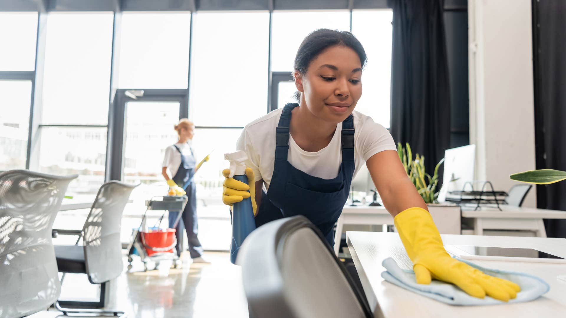 if you grew up broke but made it, you still probably can't bring yourself to buy these simple things cleaning service woman wiping down counters