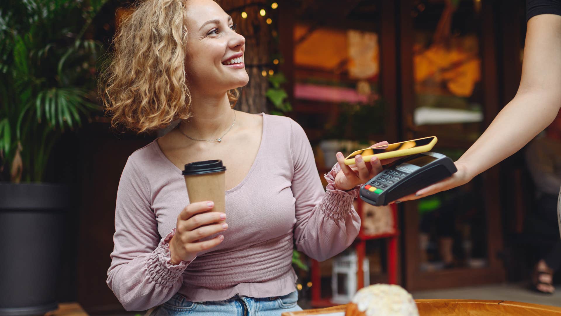 if you grew up broke but made it, you still probably can't bring yourself to buy these simple things coffee from fancy cafe woman buying coffee at a fancy cafe