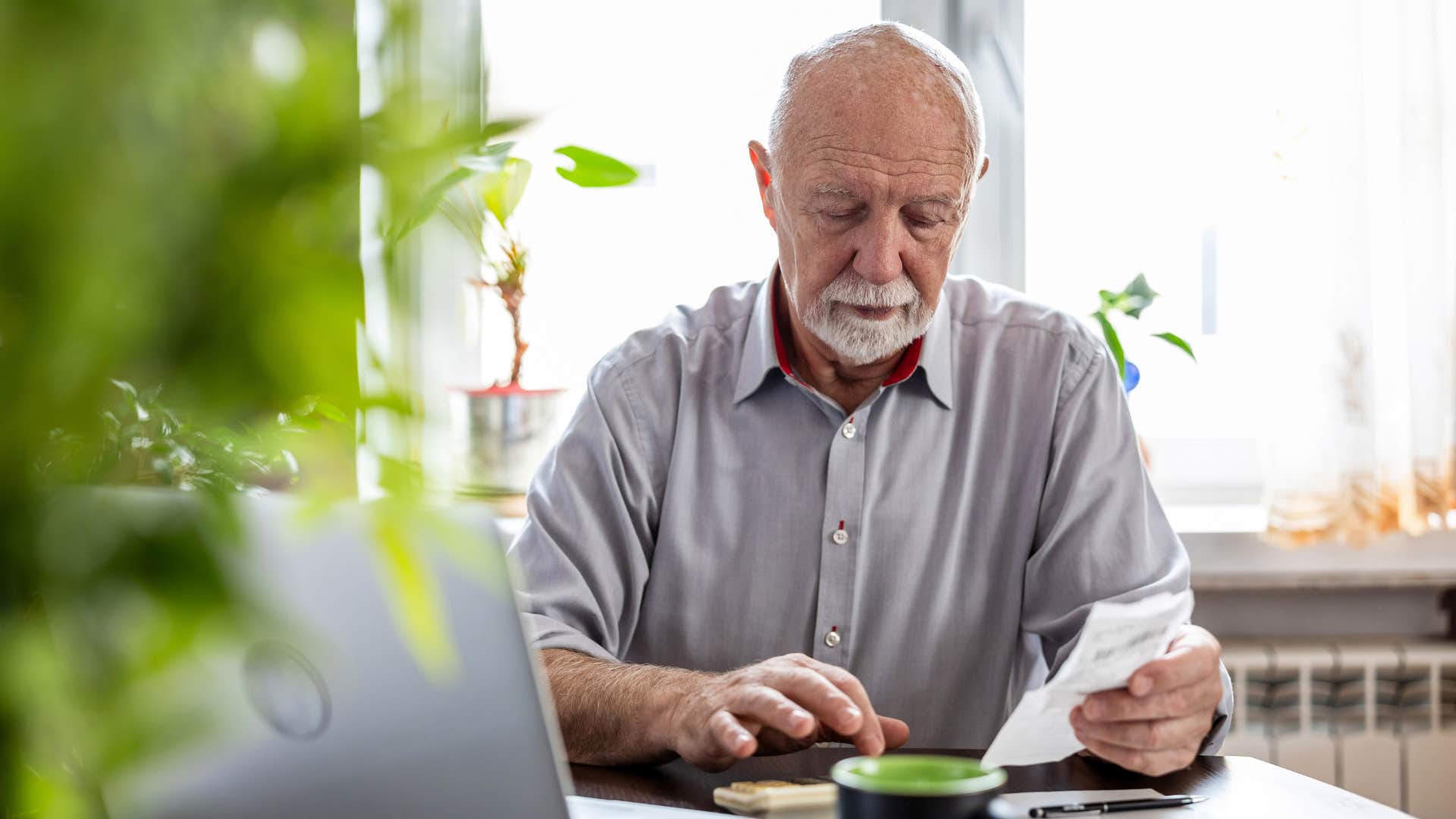 if you grew up poor, you probably have these habits that make you way better than normal people you value money like no one else man going over his finances at home