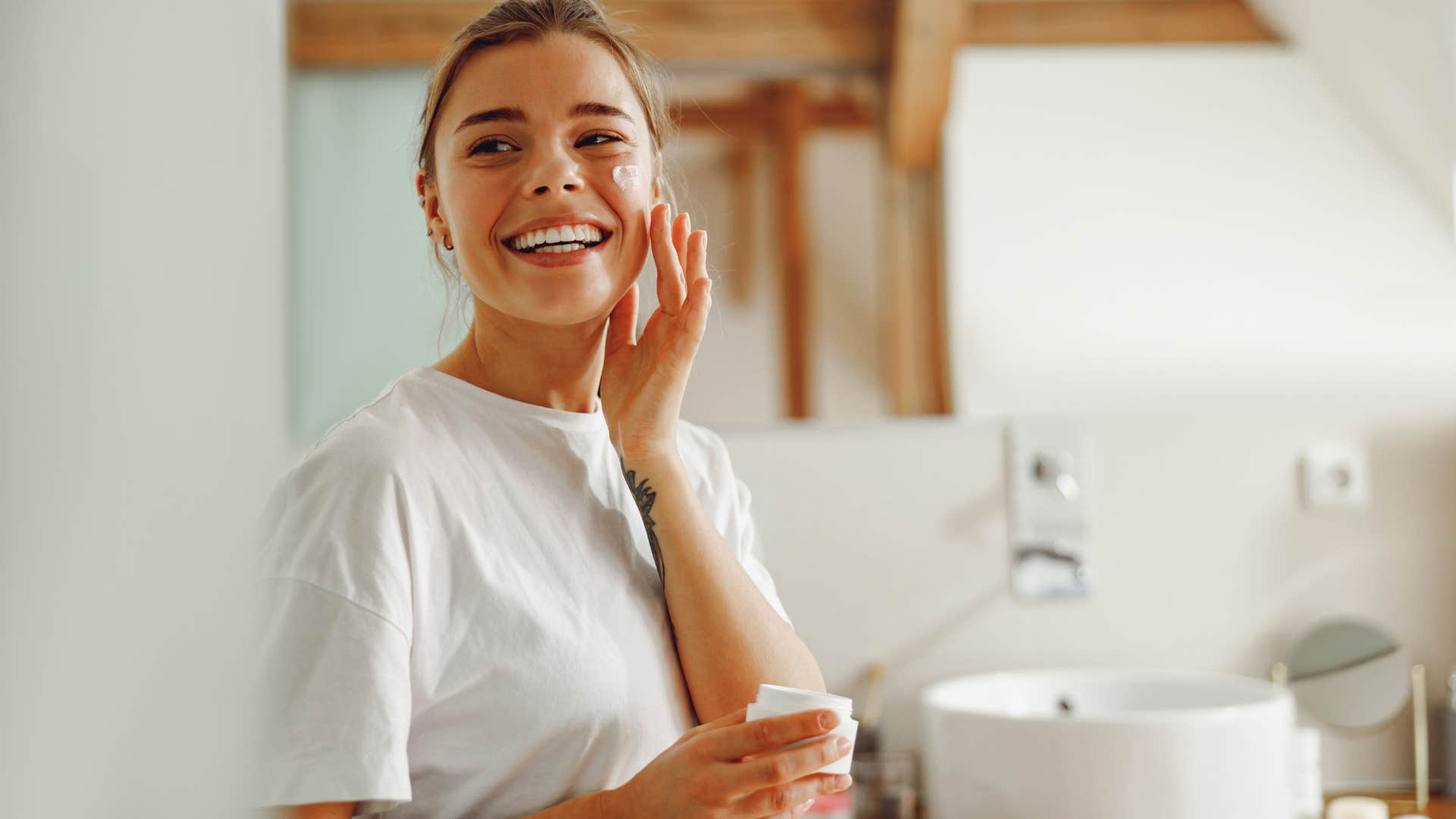 woman using fancy skincare and makeup in the bathroom
