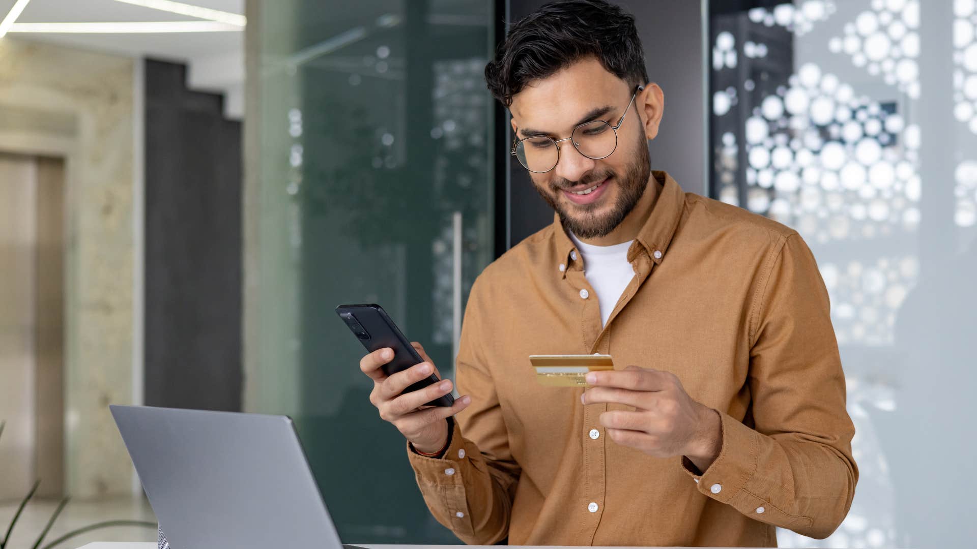 man buying subscriptions and upgrades on his phone