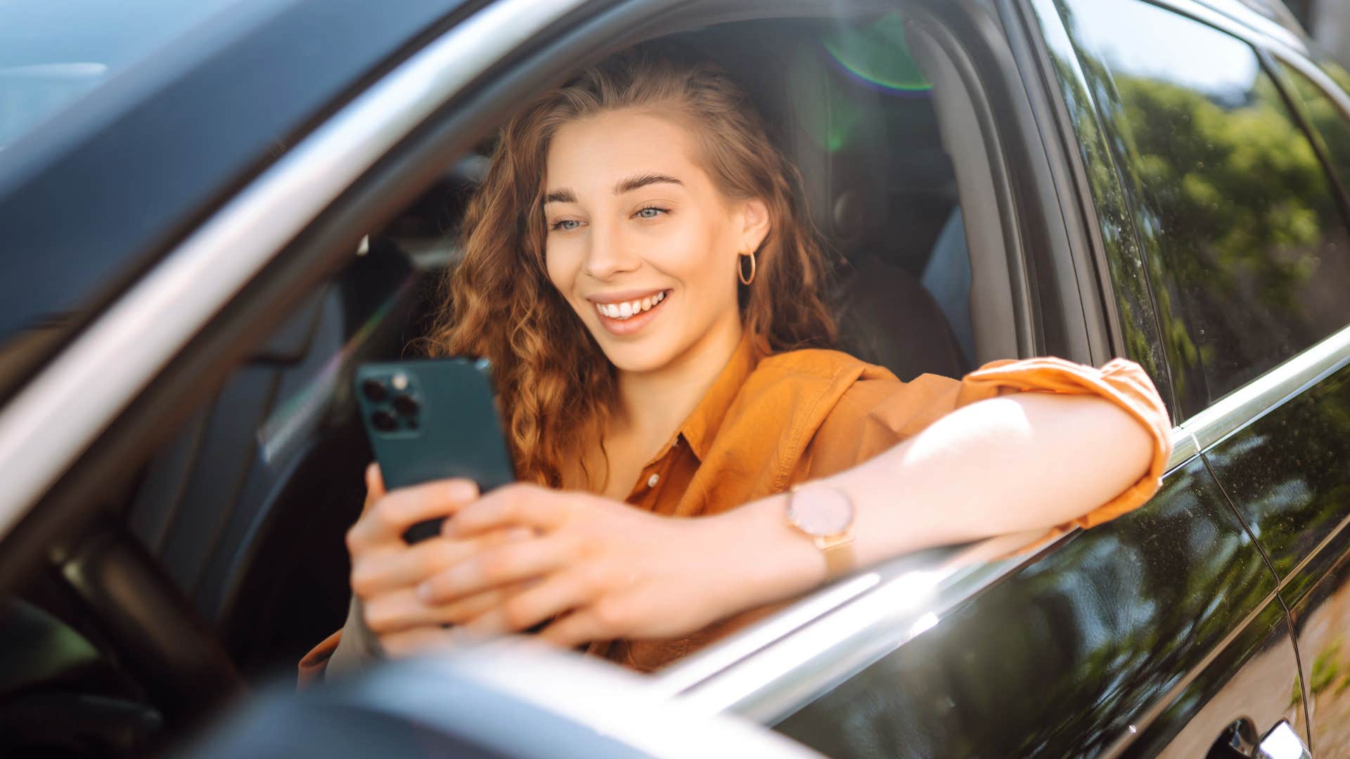 Woman who ordered online for pick-up sitting in her car.