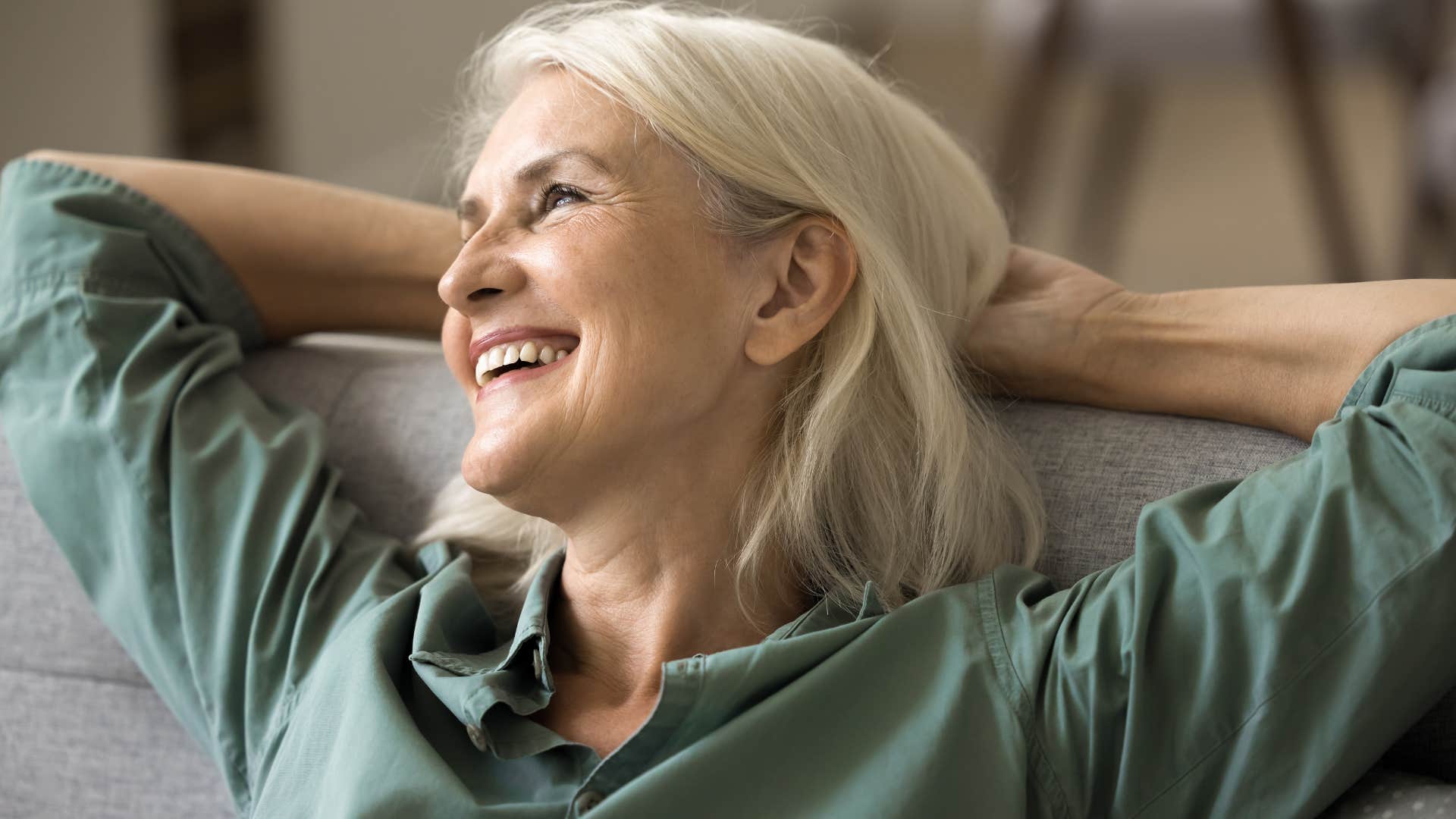 Woman finding peace in solitude and smiling.