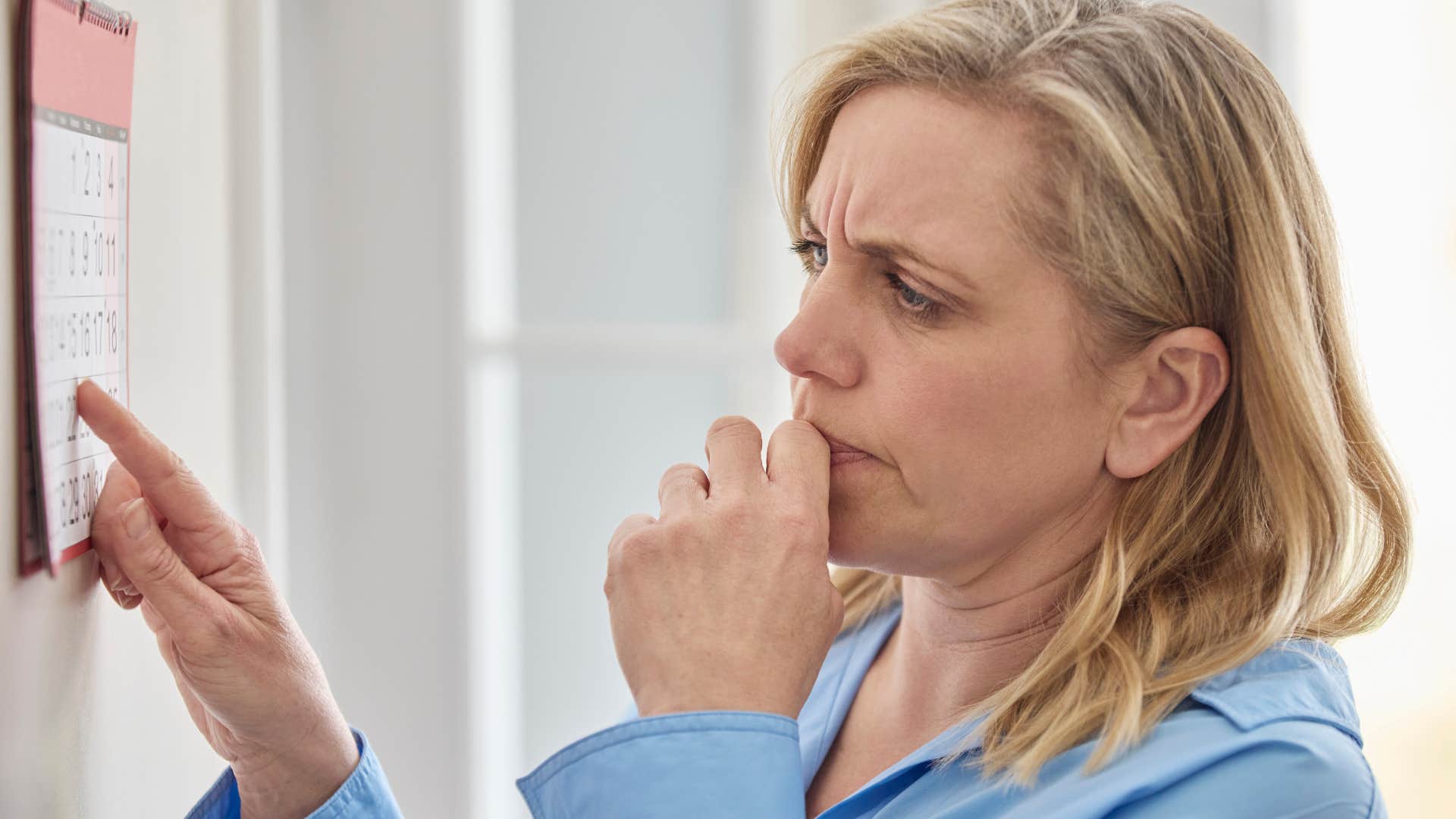 older woman reading her calendar