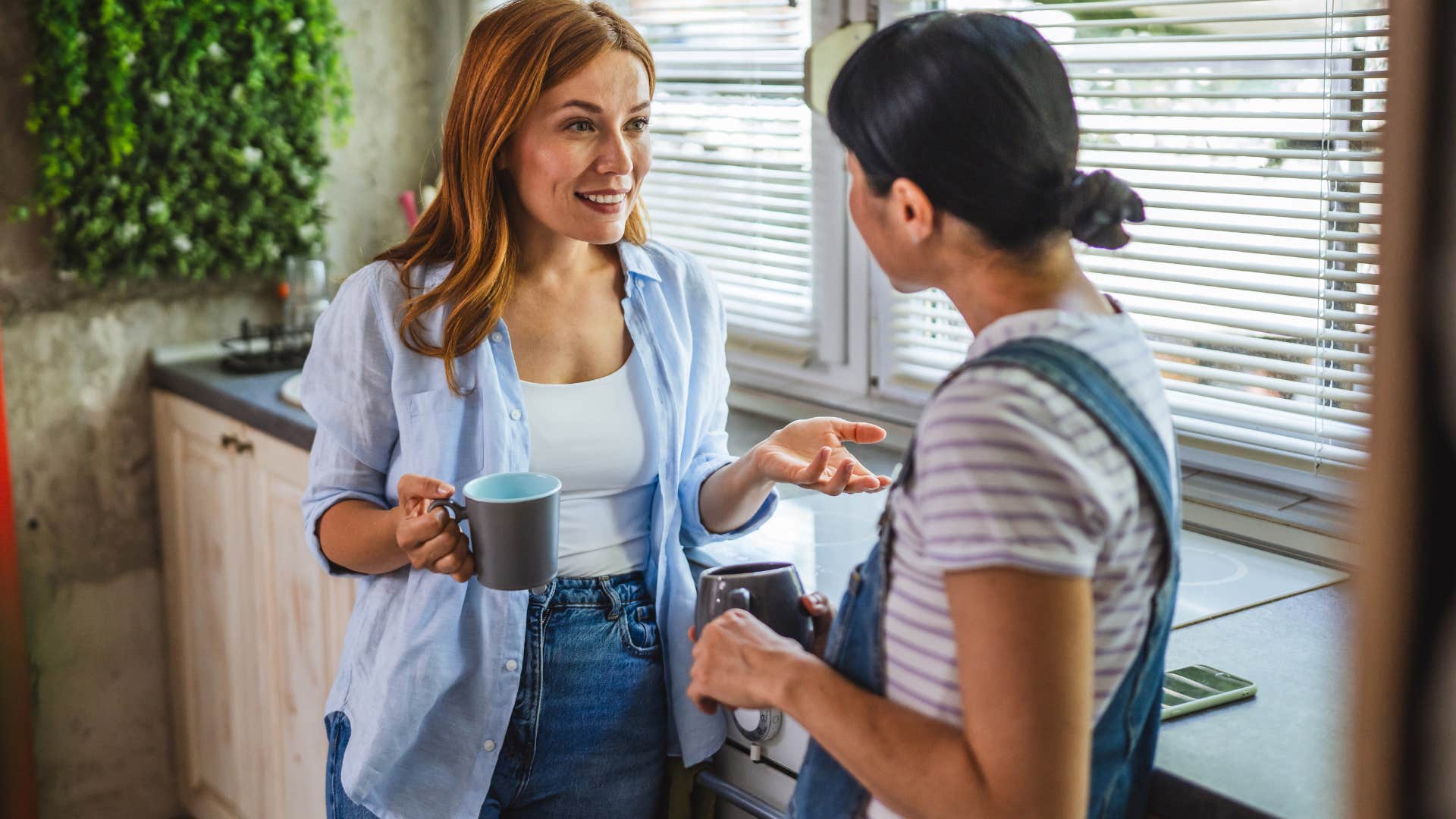 a sense of story if you notice these things missing from someone's home they've probably been through a lot in life woman talking to a friend in a home with a sense of story