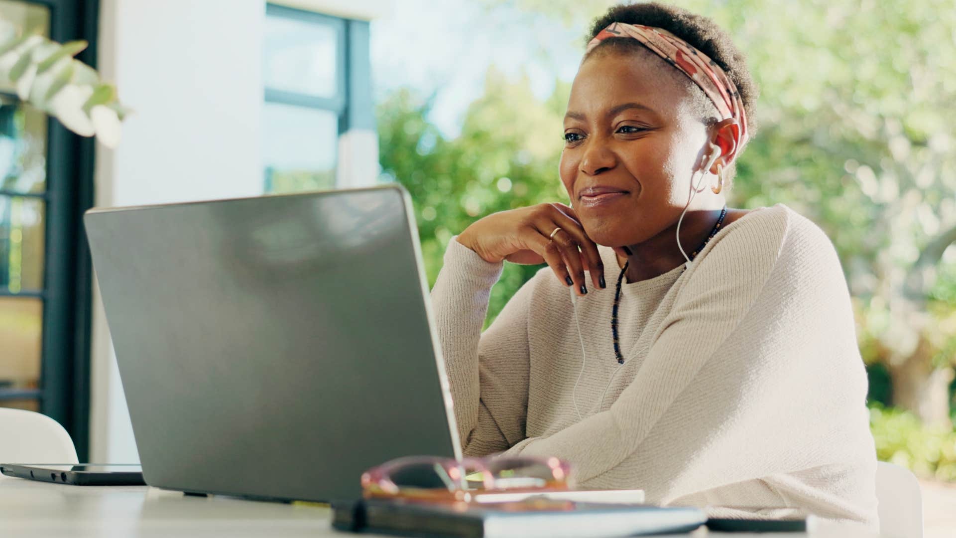 personal creative touches if you notice these things missing from someone's home they've probably been through a lot in life woman working on her laptop at home