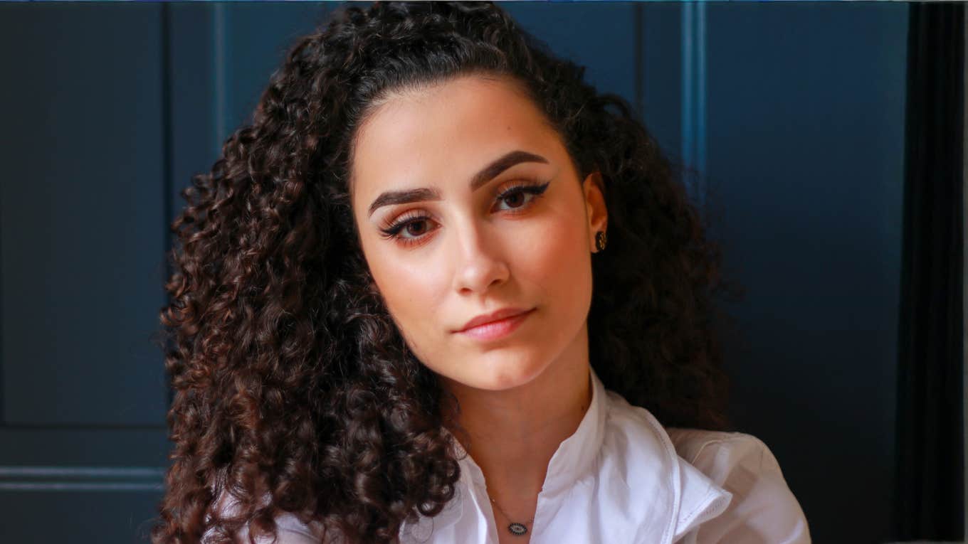 Instead Of Trying To Get Rid Of Your Jealousy, Try Leaning Into It With These Questions Woman leaning into her jealousy instead of trying to get rid of it.