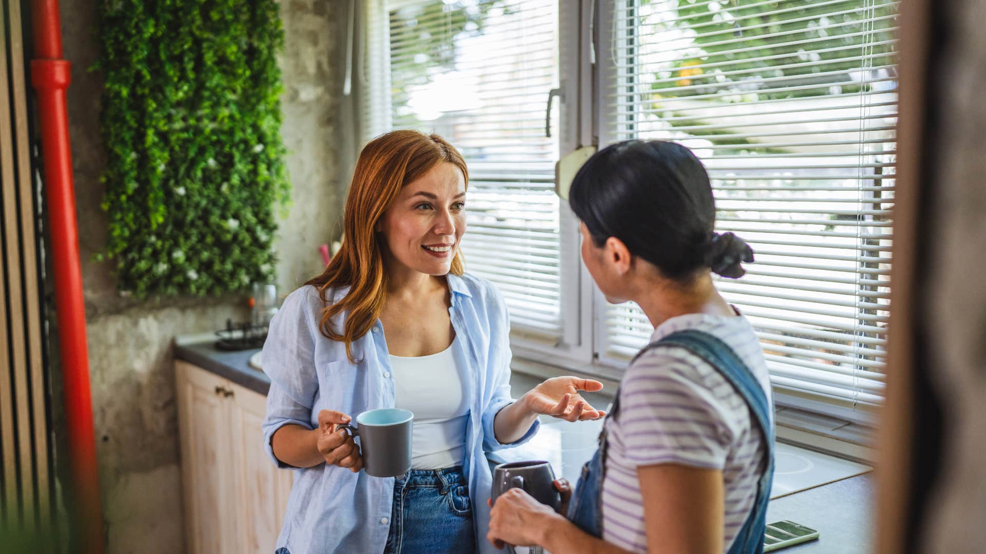 woman telling other woman bless your heart over coffee