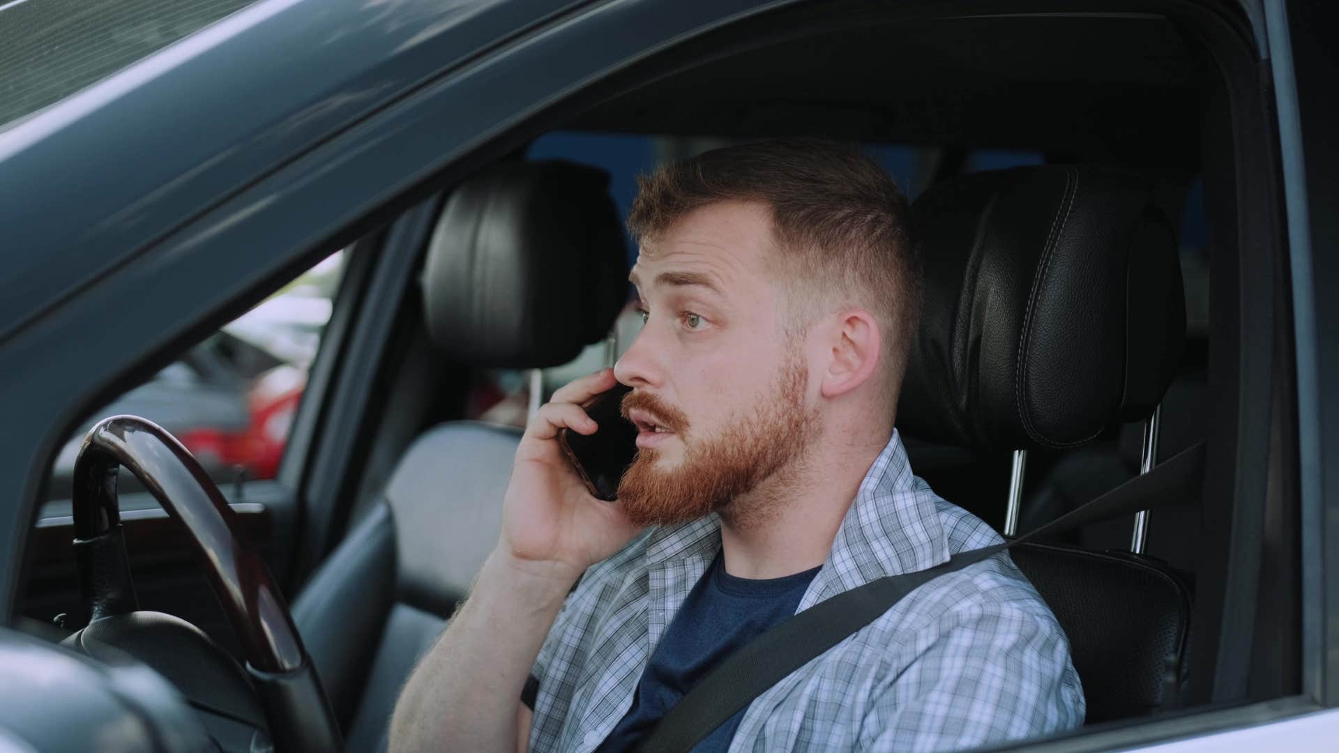 man in car on phone saying it's impossible to underestimate you