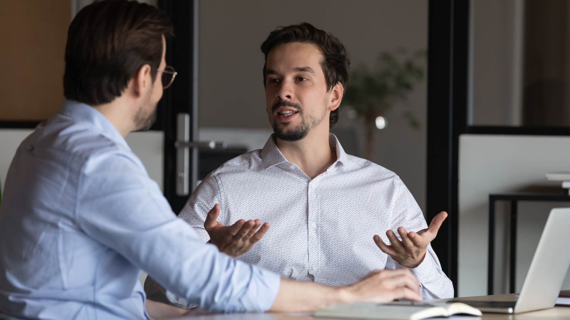 man in white shirt telling man your tomorrow is someone's yesterday