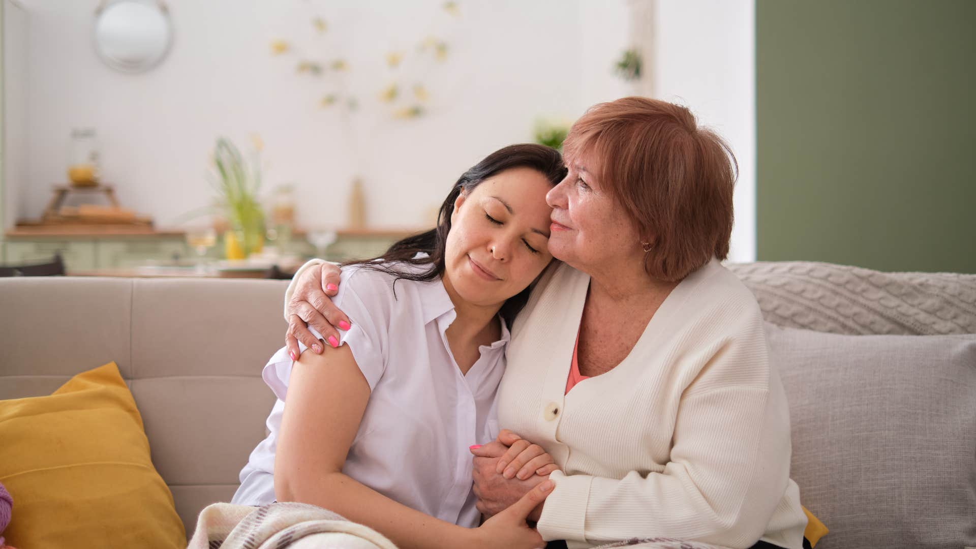 empathetic woman comforting another woman