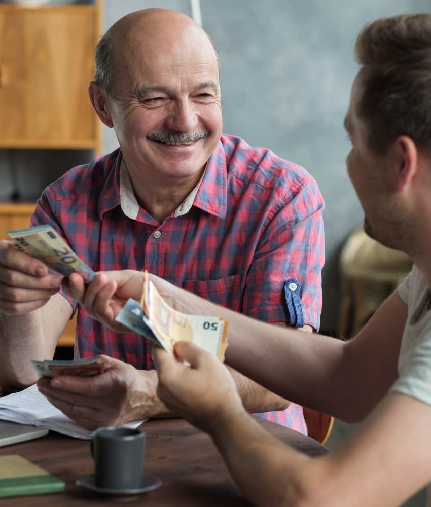 man lending his son money