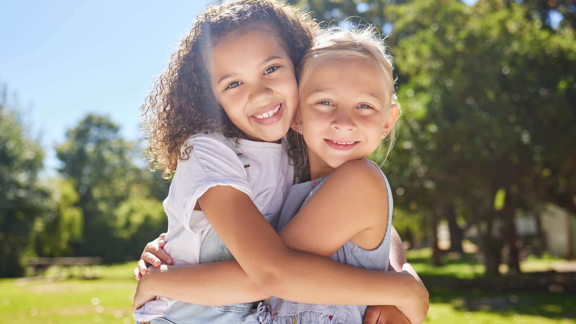 lessons the most successful kids learn from their parents protecting and caring for each other two young kids caring for each other hugging